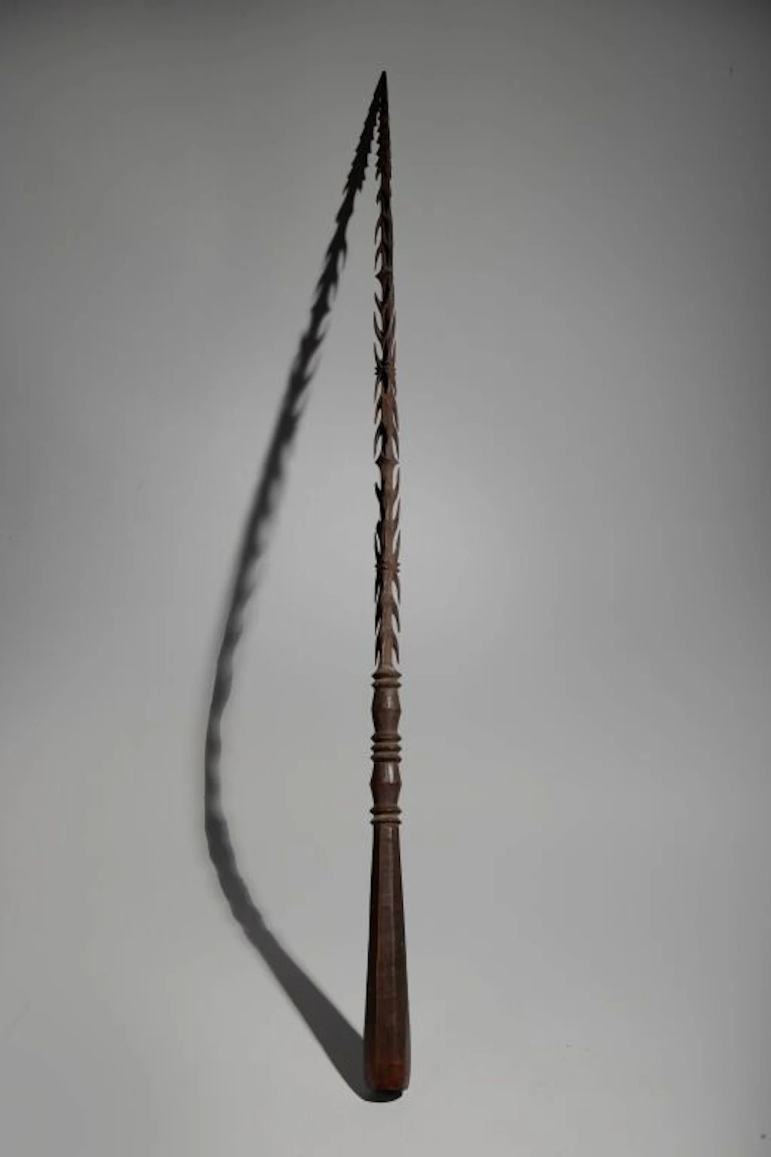 A rare hand weapon, entirely and delicately carved from a solid block