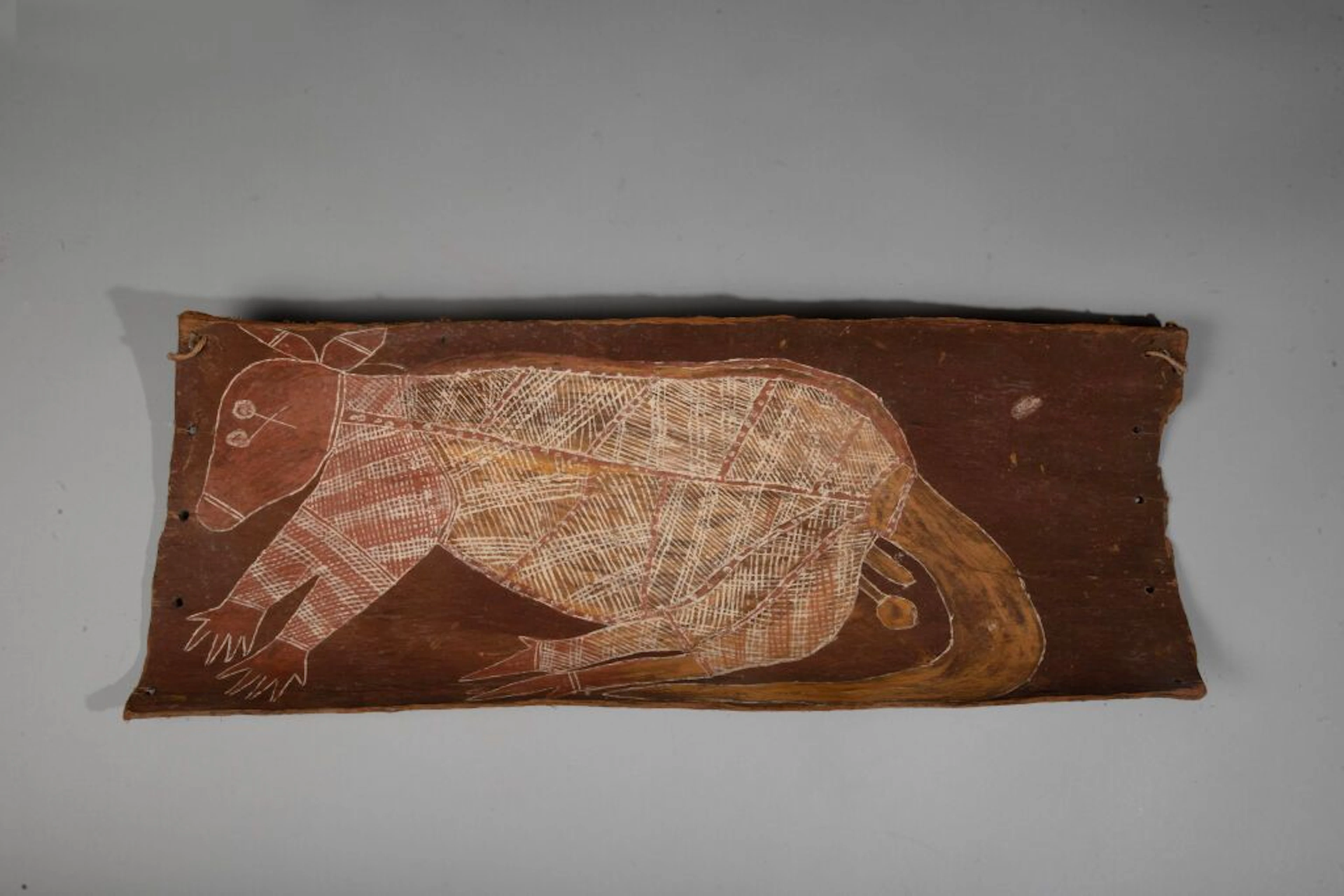 Painting on bark depicting an animal in profile (a kangaroo?) in the