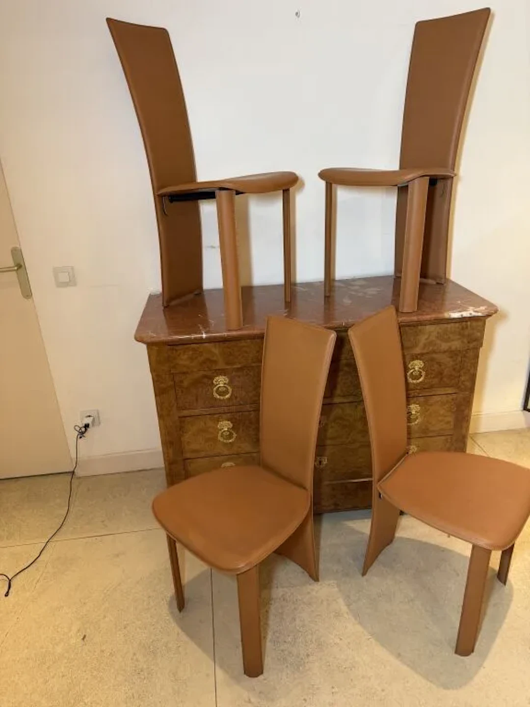 FRAG, Italy. Set of four chairs in tan leather with topstitching