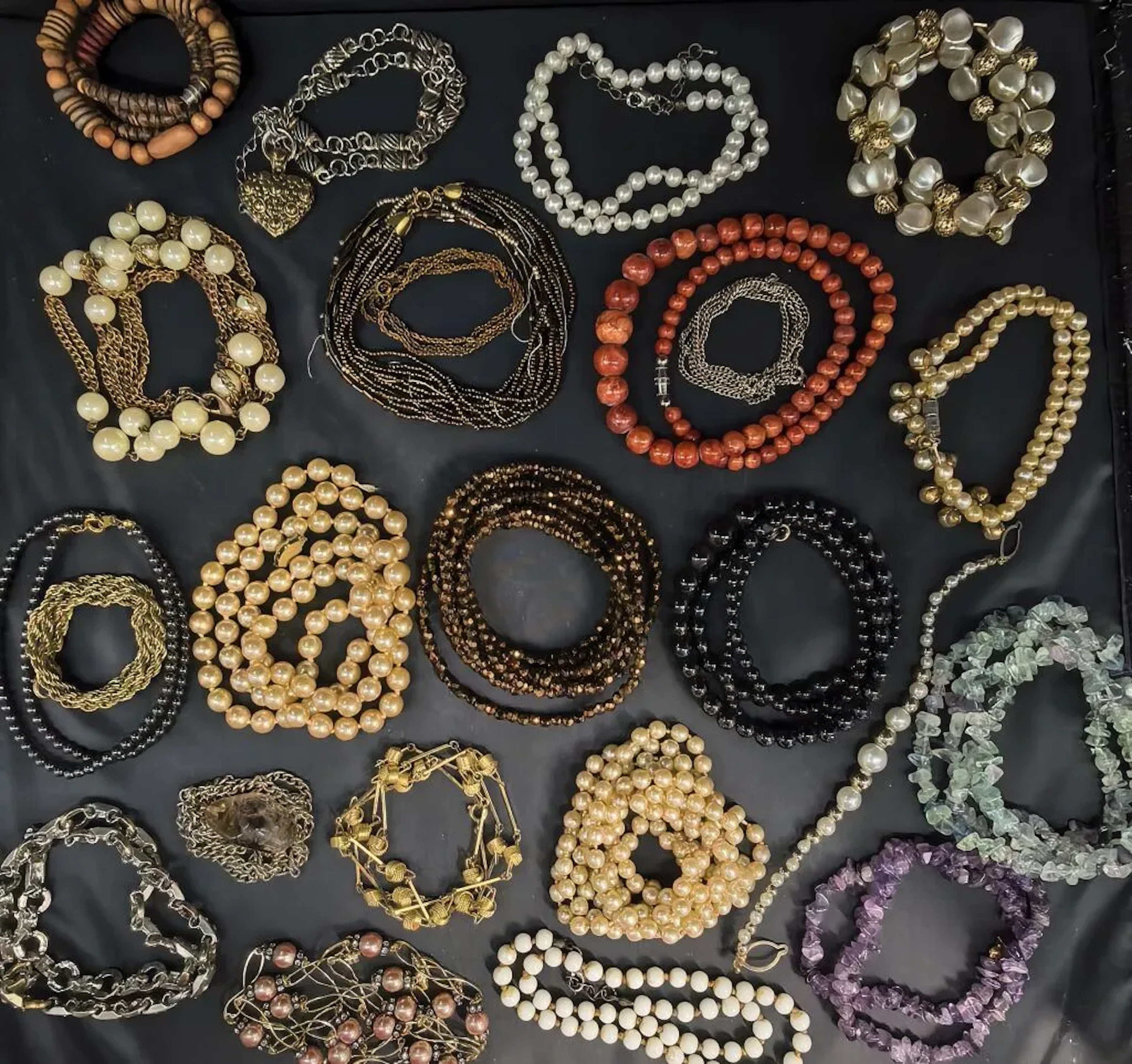 A collection of costume jewelry—a basket filled with stylized snakes