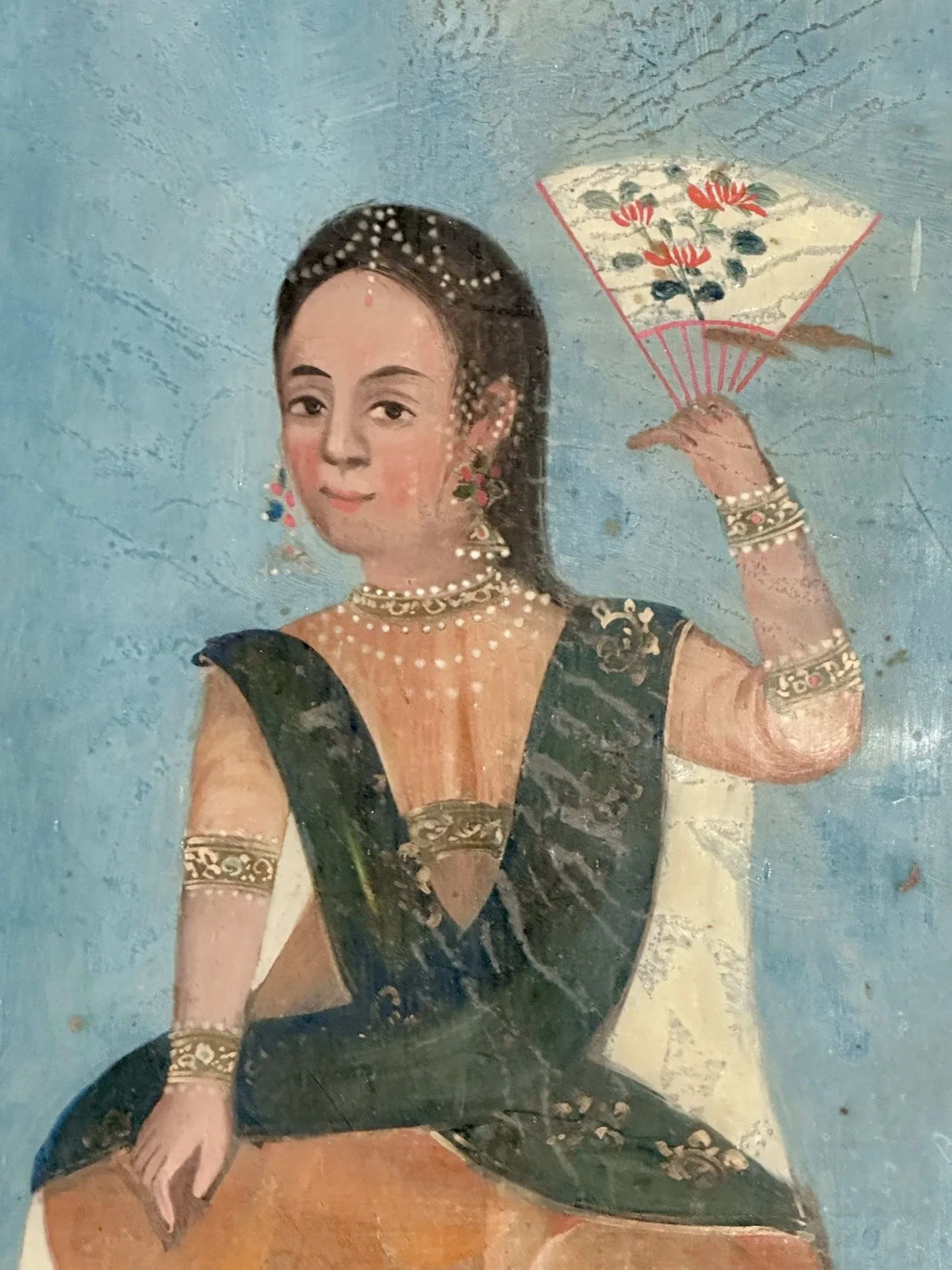 INDIA, 19th century. Young woman with a fan. Mounted under glass in
