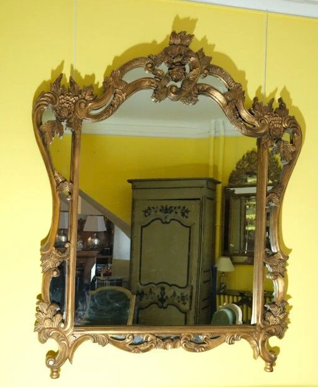 Gilded wooden picture frame in the 18th-century style, decorated with