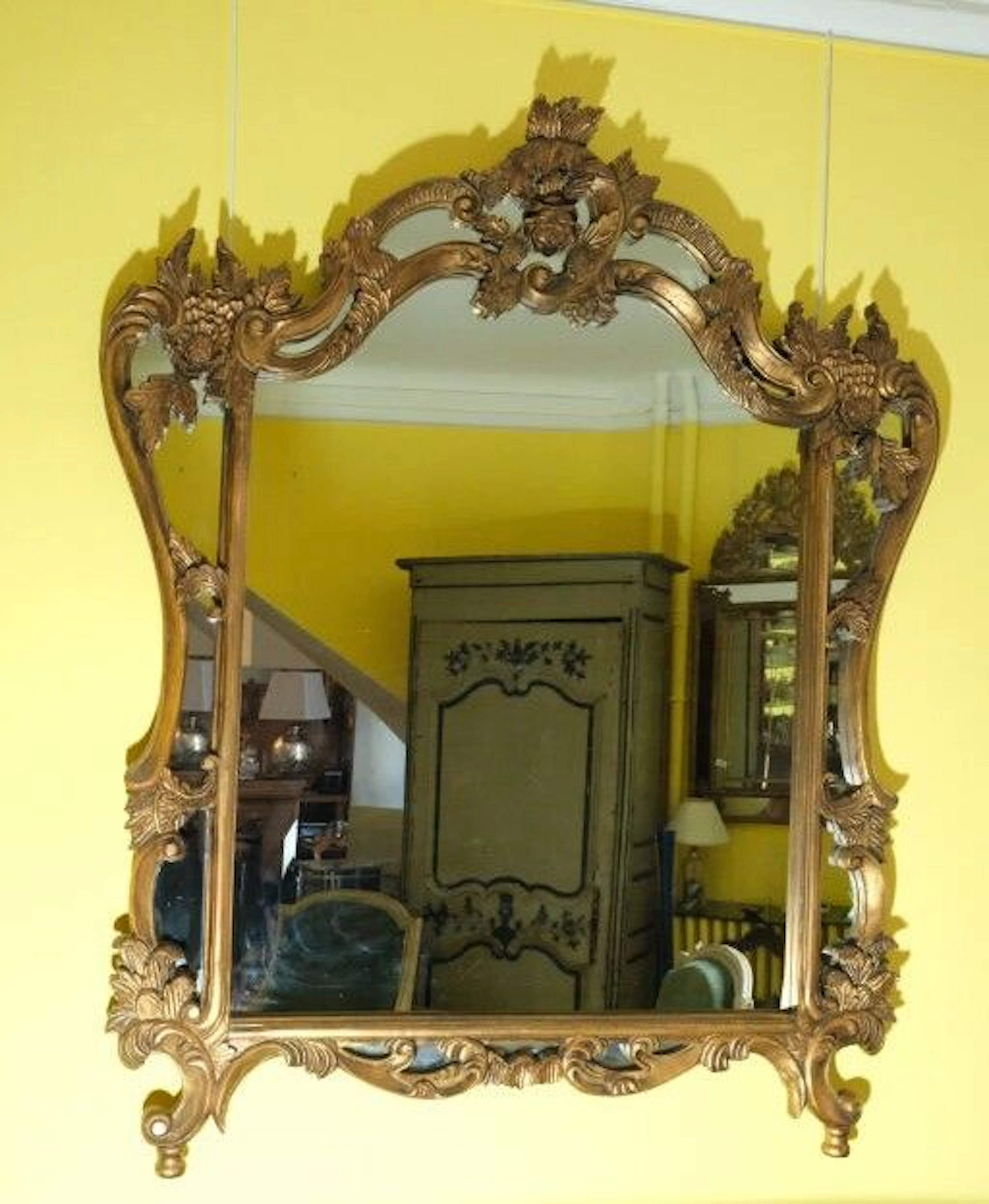 Gilded wooden picture frame in the 18th-century style, decorated with