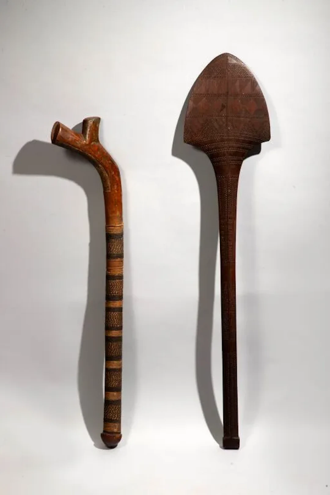 A rifle-stock mace that has retained its entire braided fiber cord