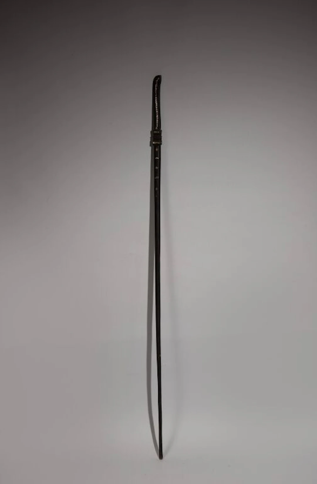 Ebony walking stick inlaid with mother-of-pearl depicting a stylized