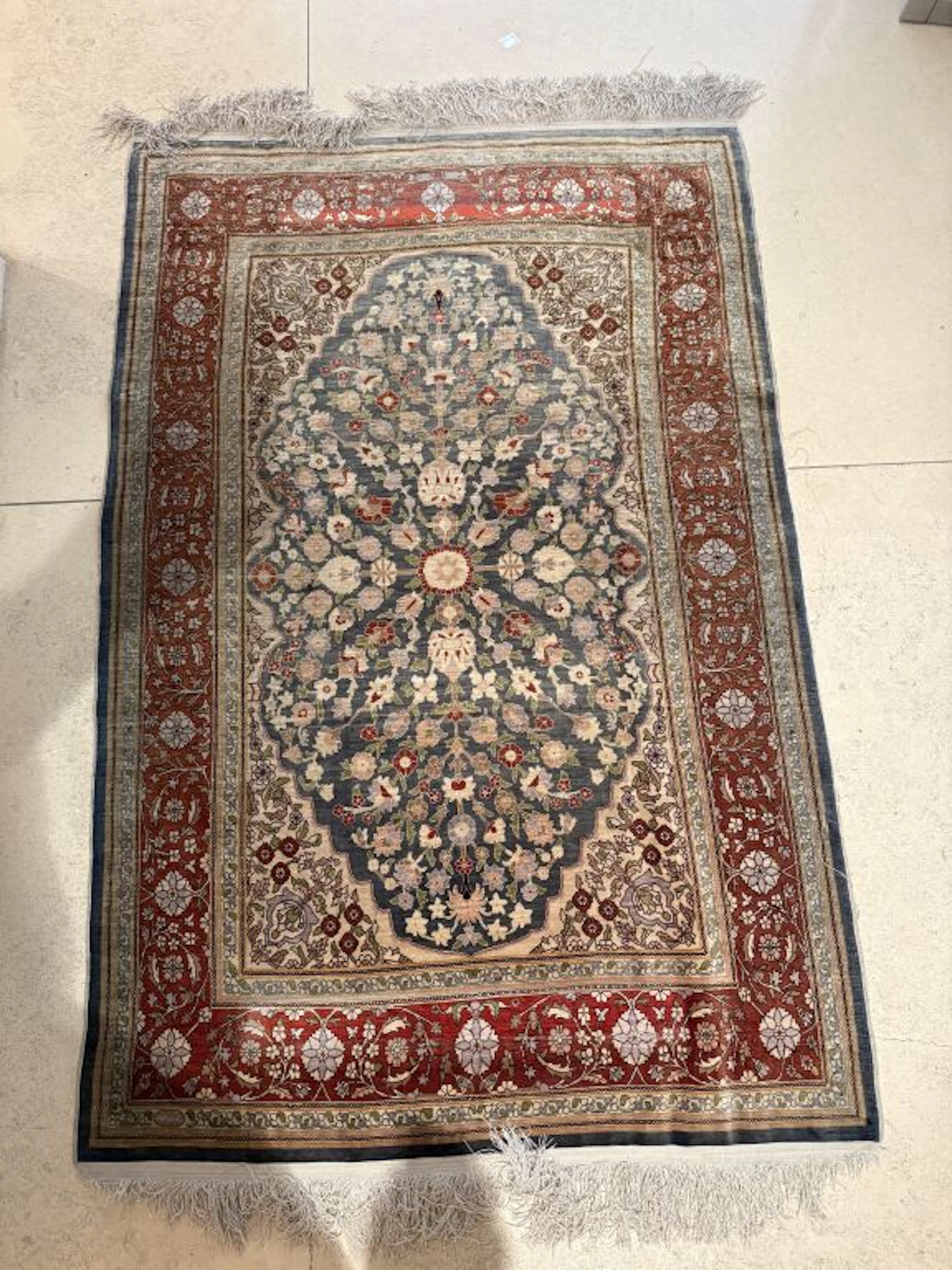 TURKEY OR PERSIA. A set of four silk rugs featuring stylized plant