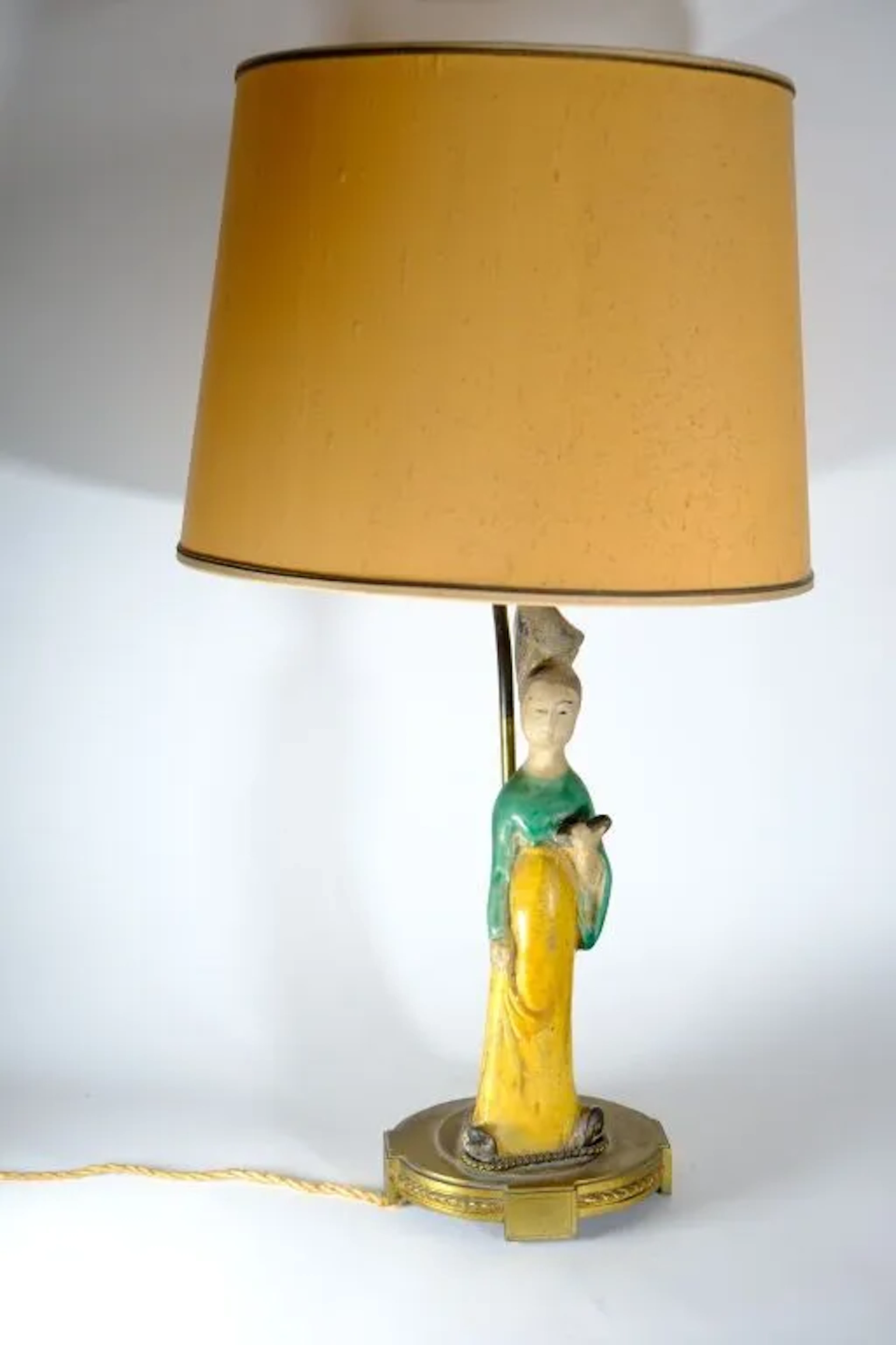 CHINA. Standing court lady figurine in yellow, green, and black glazed