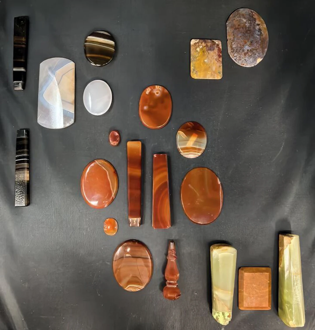 A fine collection of natural stone plates: - banded and unbanded carnelian