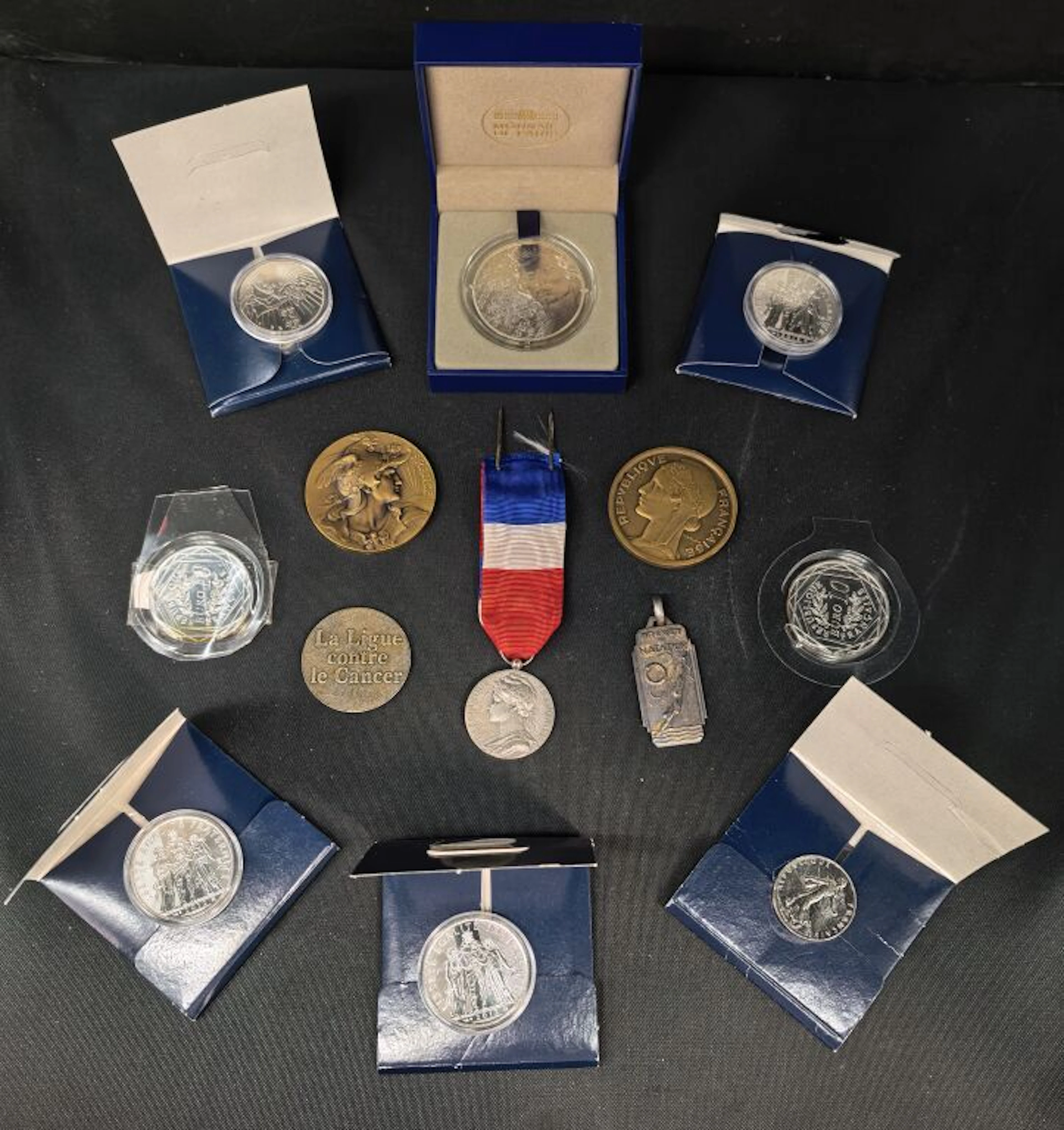 A set of precious coins stamped "Monnaie de Paris," made of silver