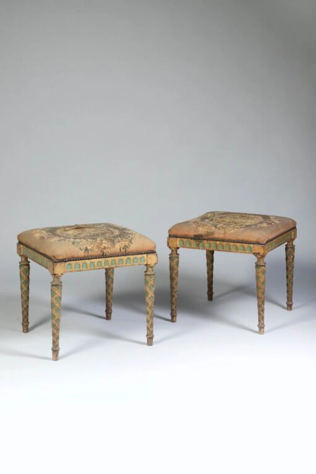 Pair of wooden stools with a cream and green lacquer finish; the four