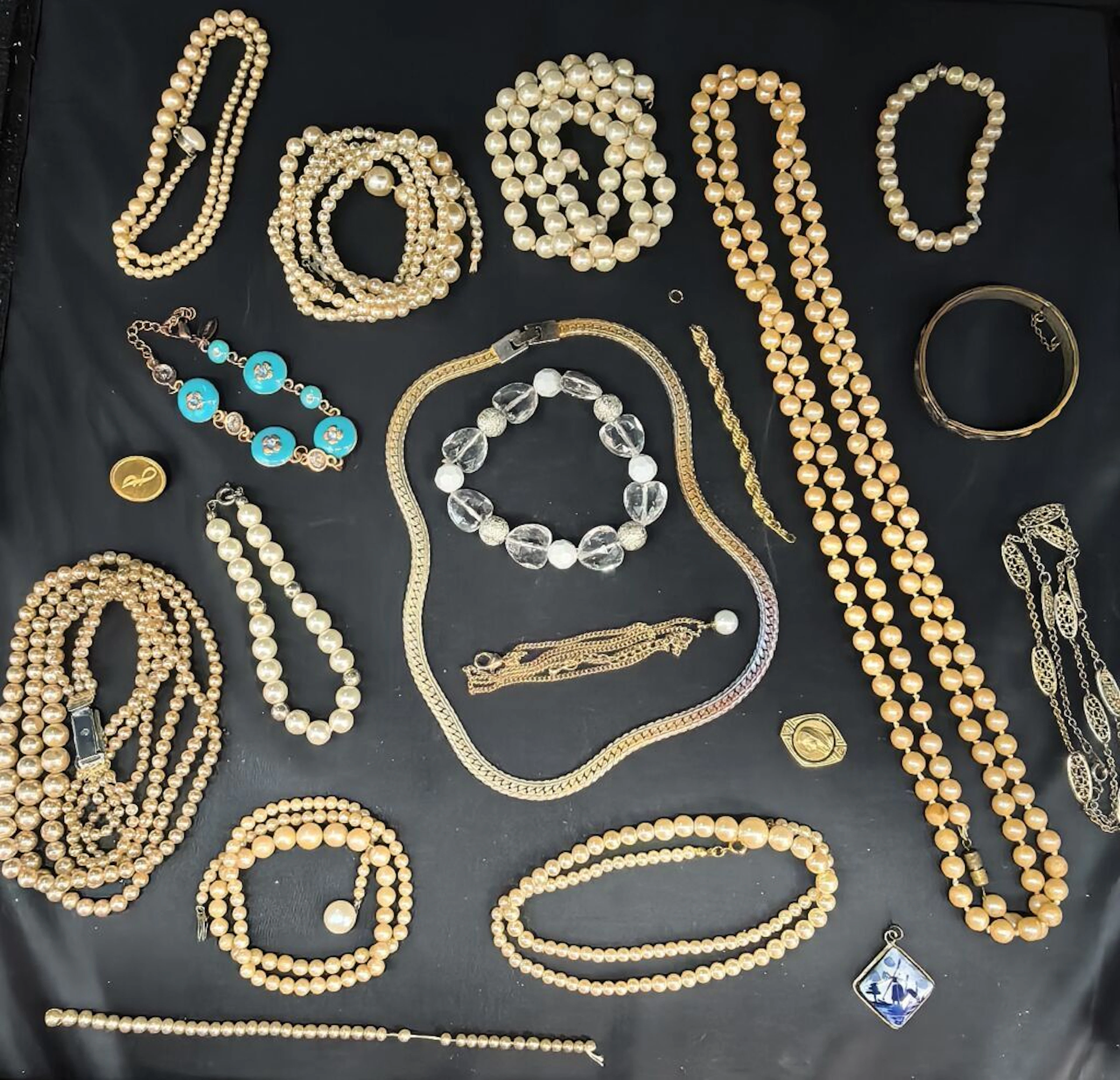 A collection of costume jewelry, including numerous imitation pearl