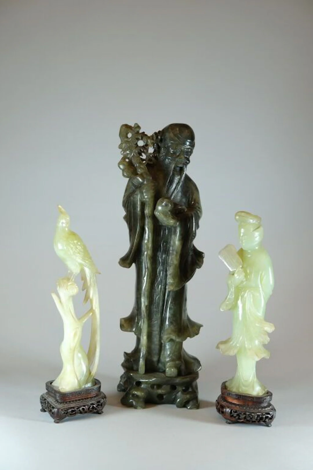 CHINA, 20th century. Lot consisting of a bird on a branch and a deity