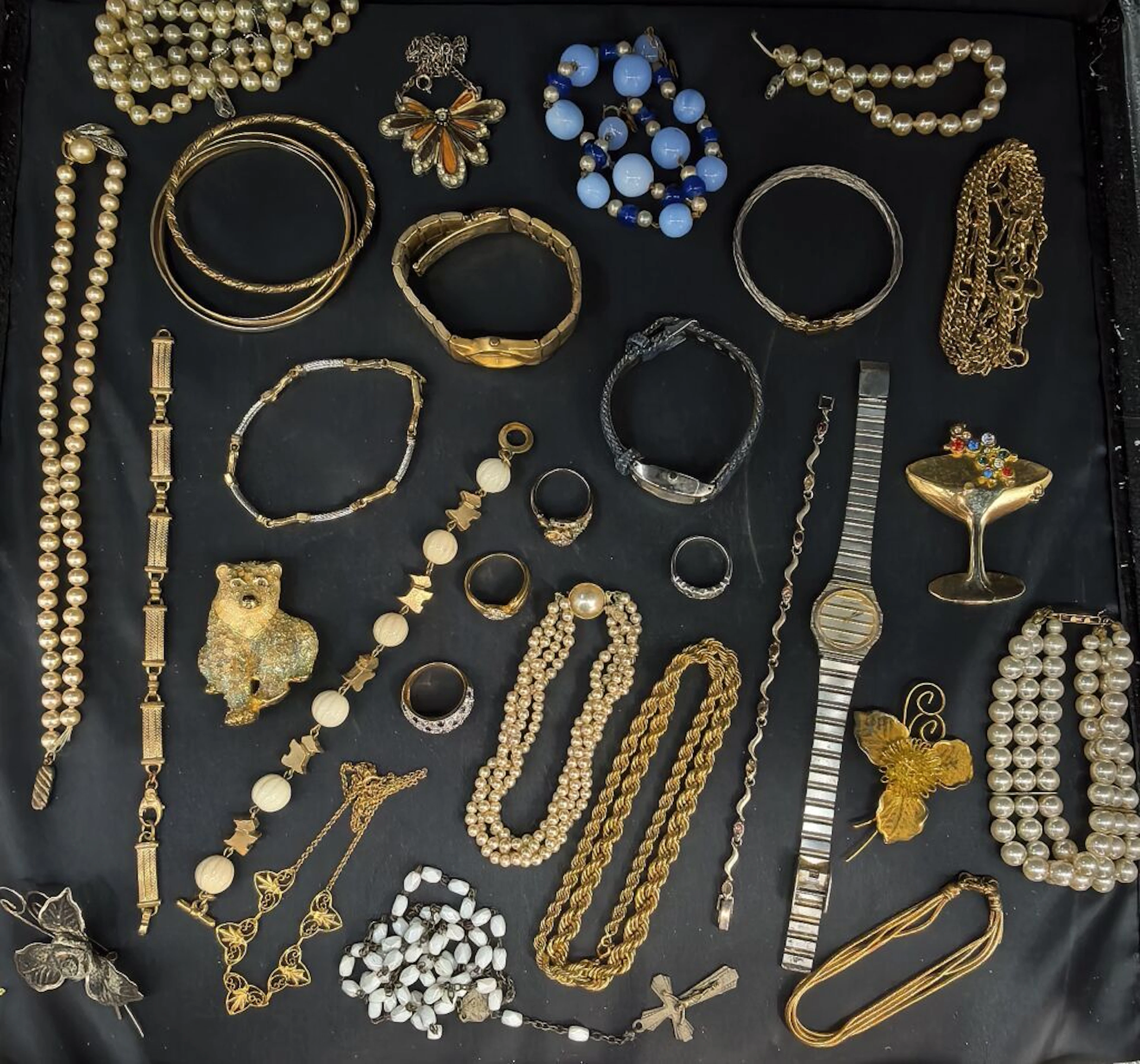 A set of costume jewelry made of standard metals, including numerous