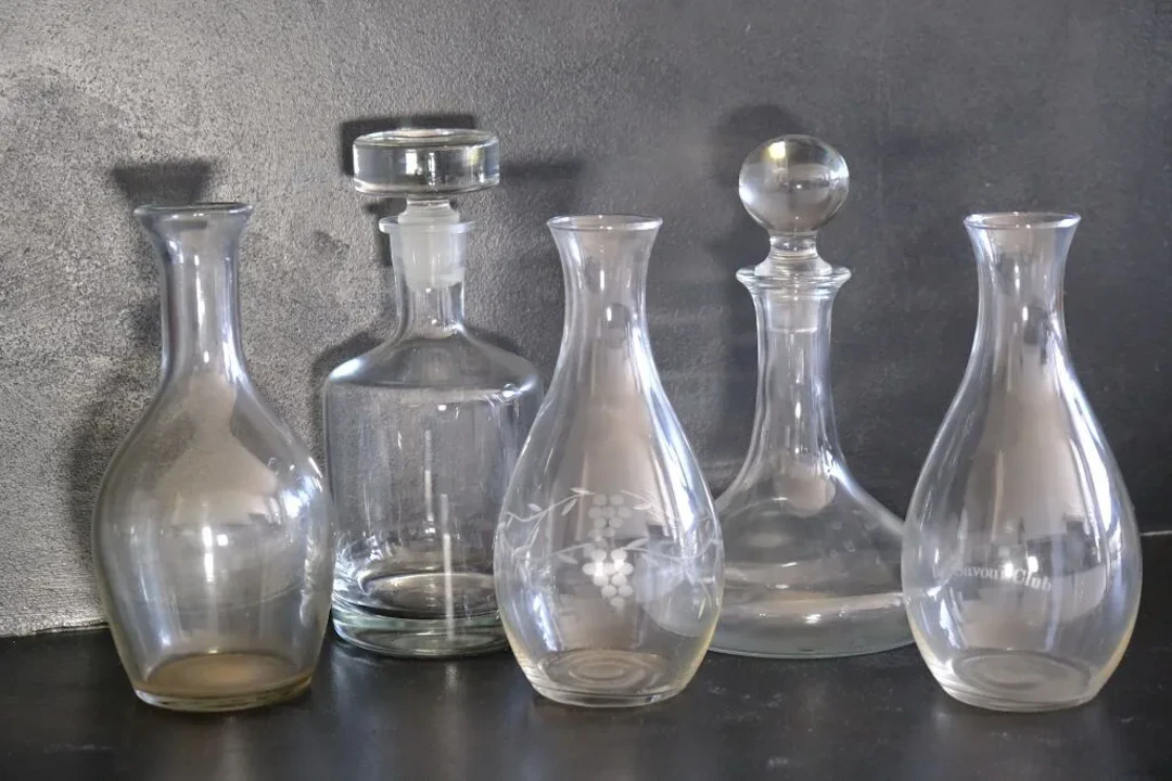 Set of two carafes with their stoppers and three glass and blown-glass