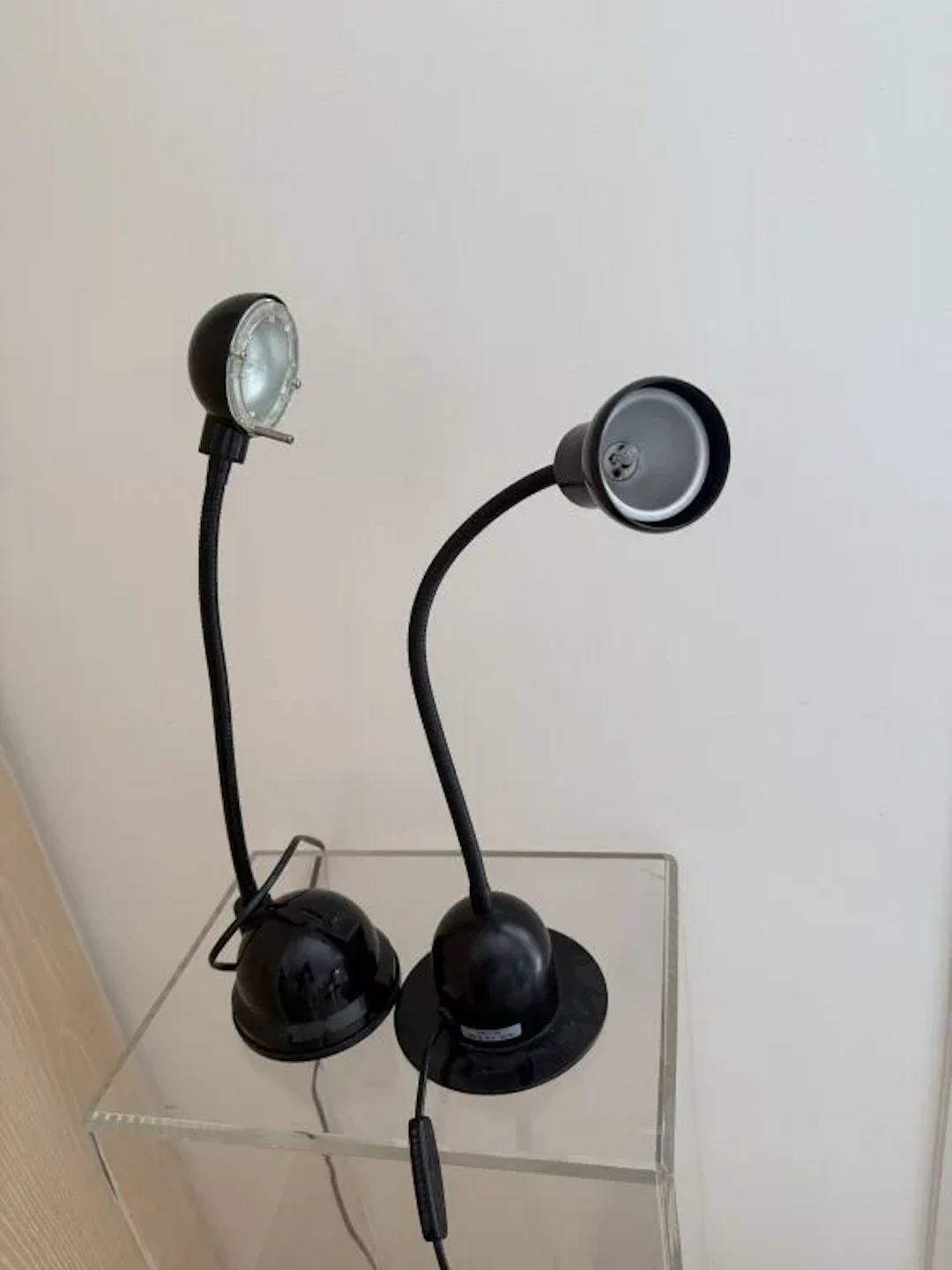 Two small adjustable desk lamps with articulated stems. Height of