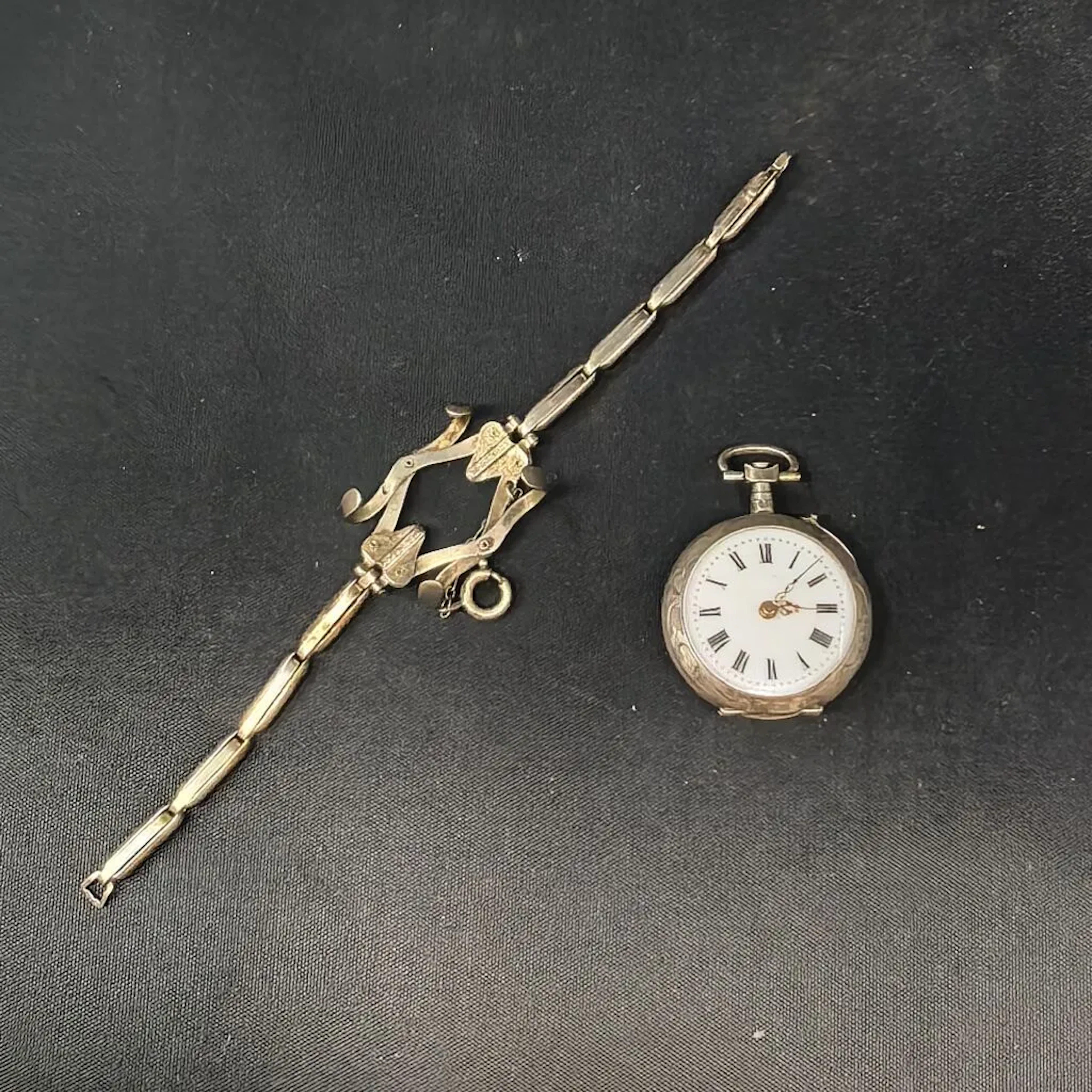 Pocket watch and adjustable strap, both made of 800‰ silver. Probably