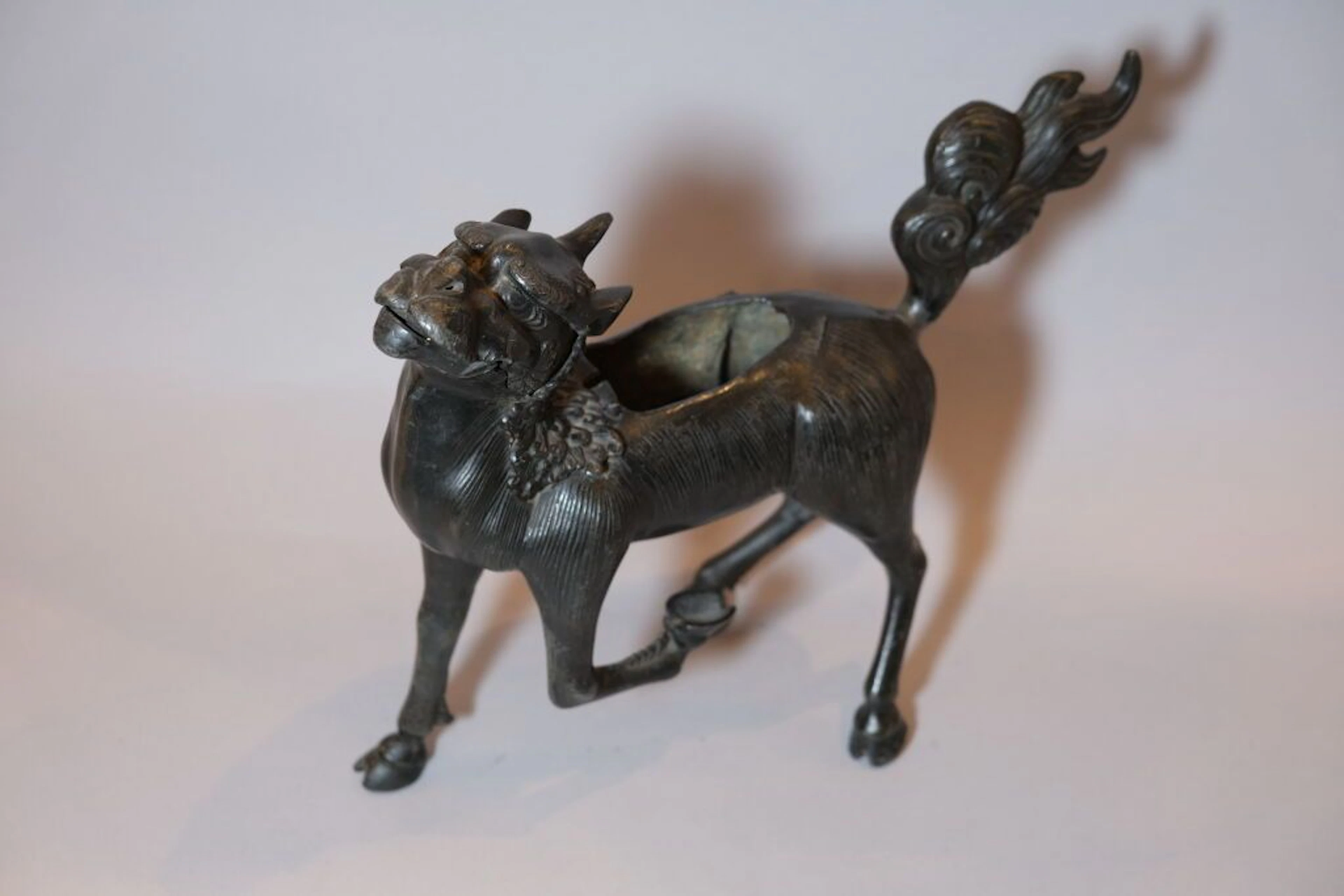 CHINA, 20th century. Large patinated bronze Qilin used as an incense