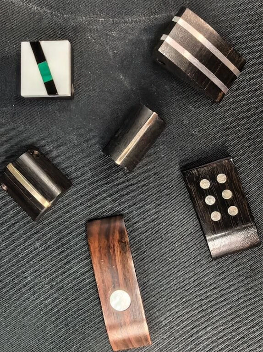 A. Bataillon, Paris, circa 1975. Set of six pendants made of rosewood
