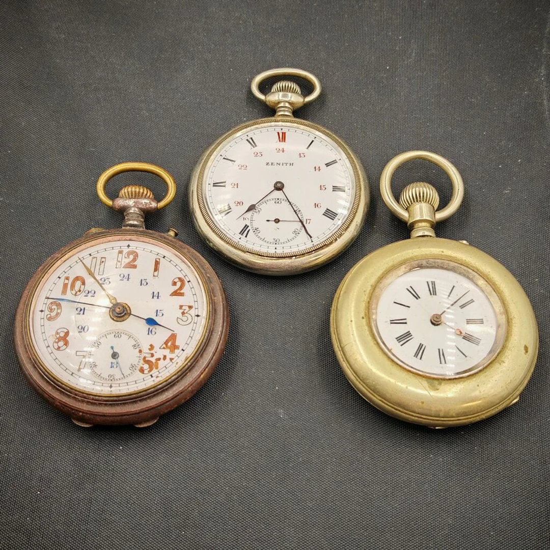 A set of three metal pocket watches, including one marine savonnette