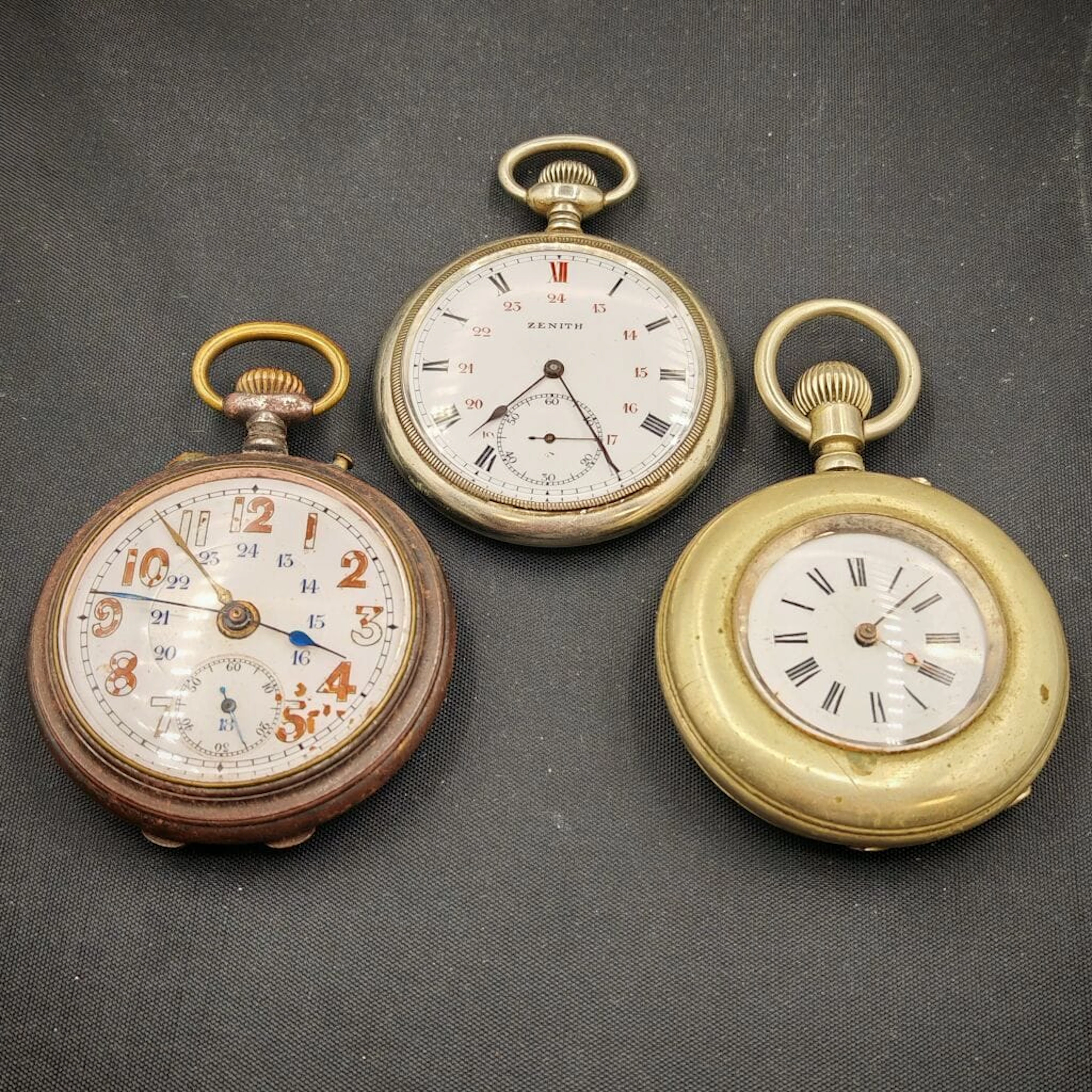 A set of three metal pocket watches, including one marine savonnette