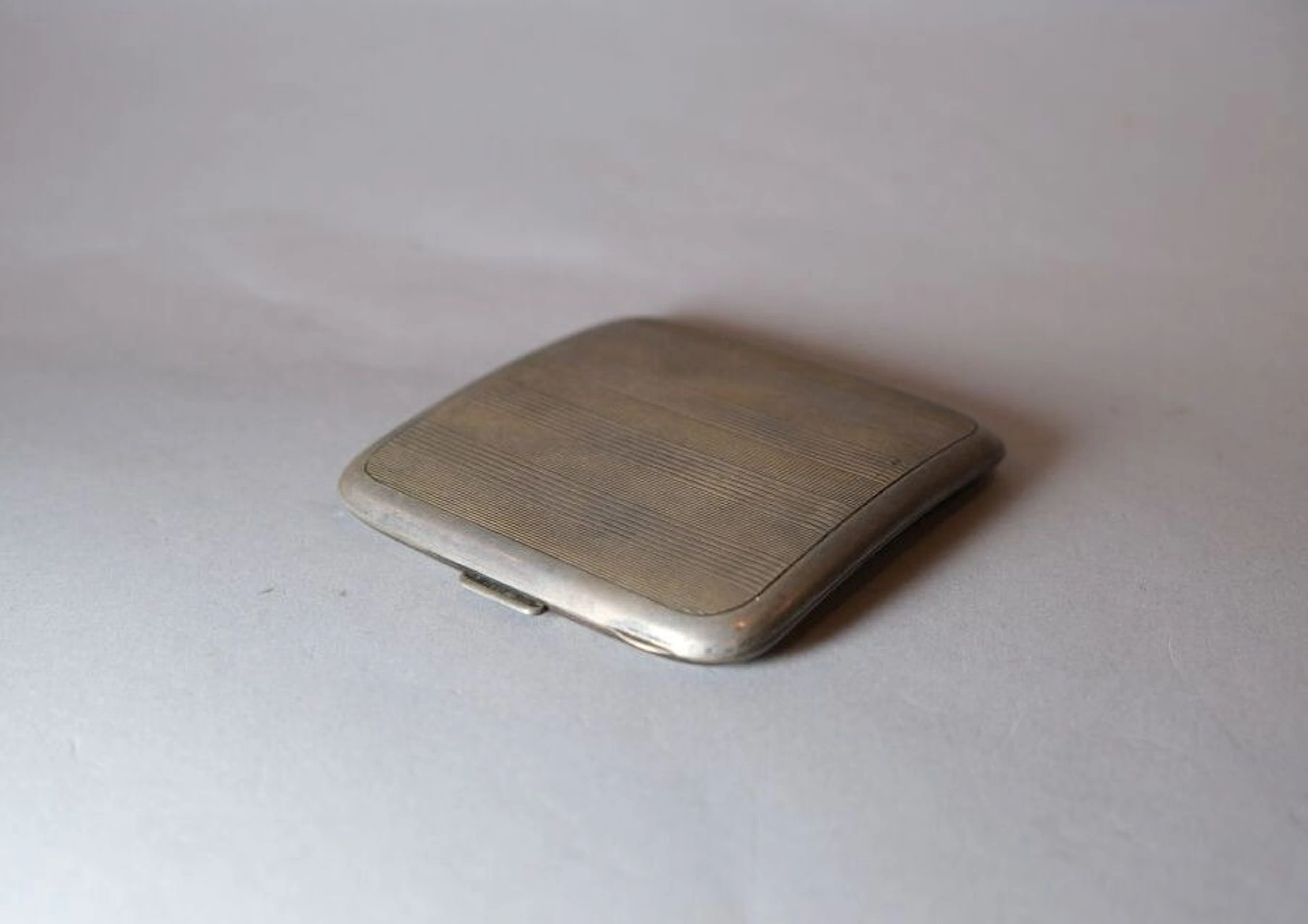 A guilloché cigarette case made of 925‰ silver, stamped with the Minerve