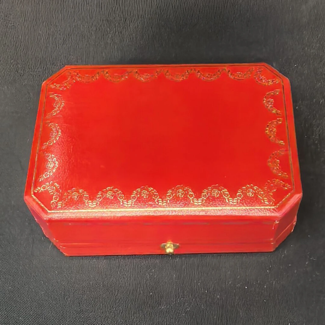 CARTIER, ref. CO 4525. A case for a brooch or pin, with gold-tone