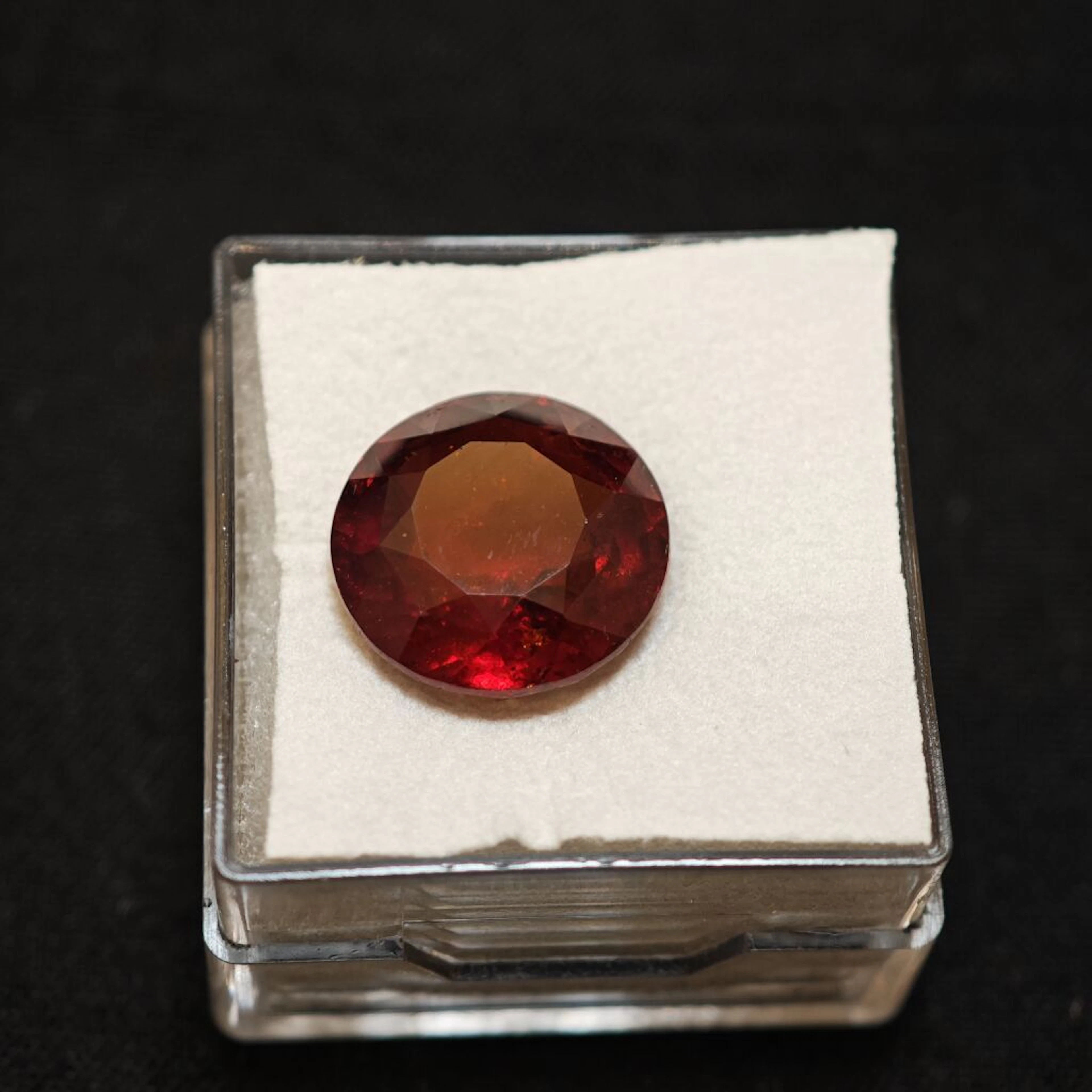 Round garnet weighing 9.77 cts. 2.8 x 12.5 x 7.6 mm.