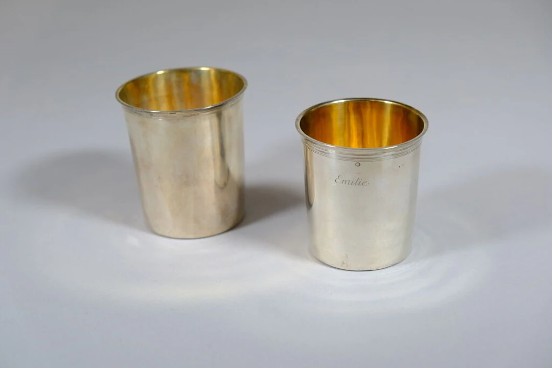 A set of two conical 800/1000 silver goblets, one marked "Emilie"