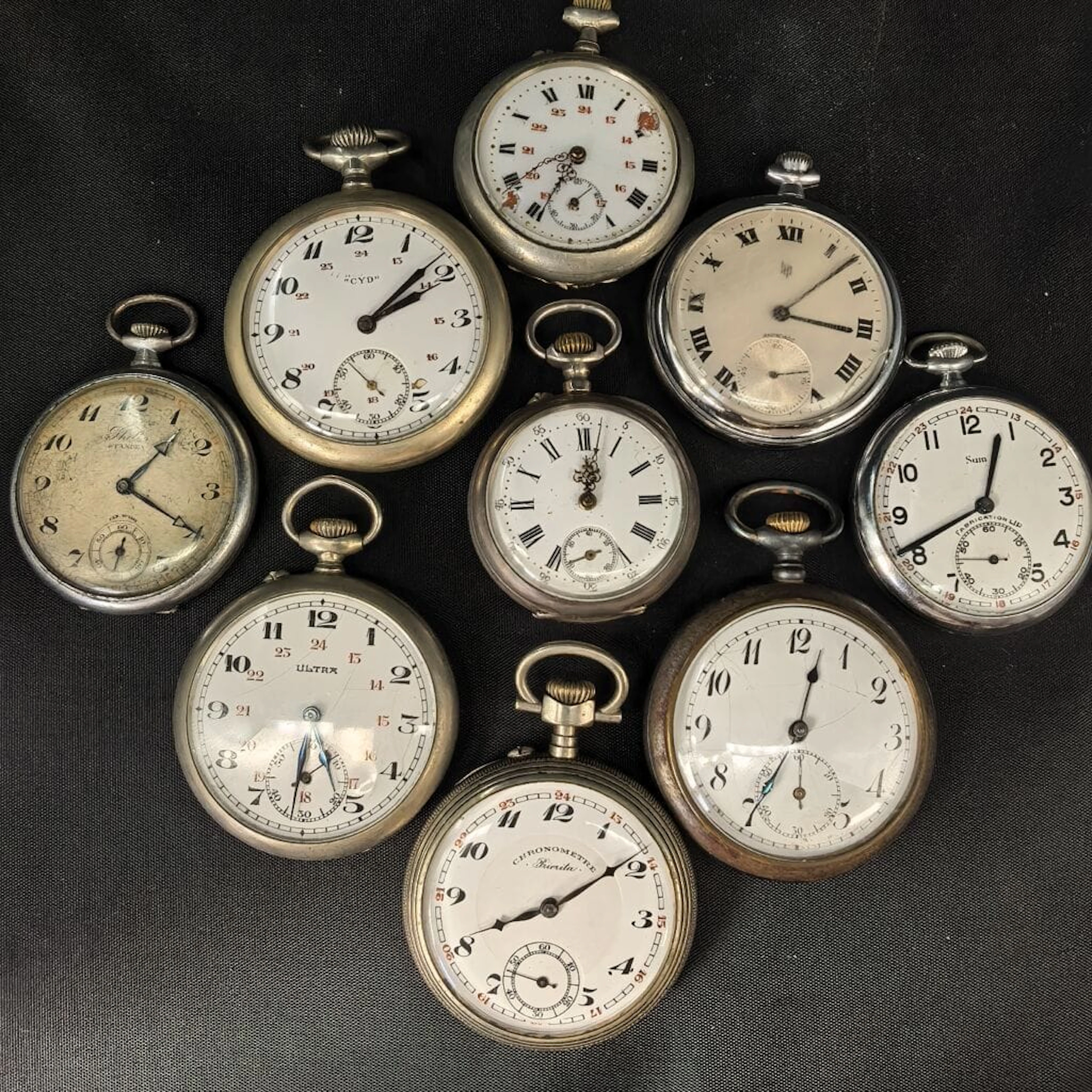 A set of nine pocket regulators, including one in silver with a gross