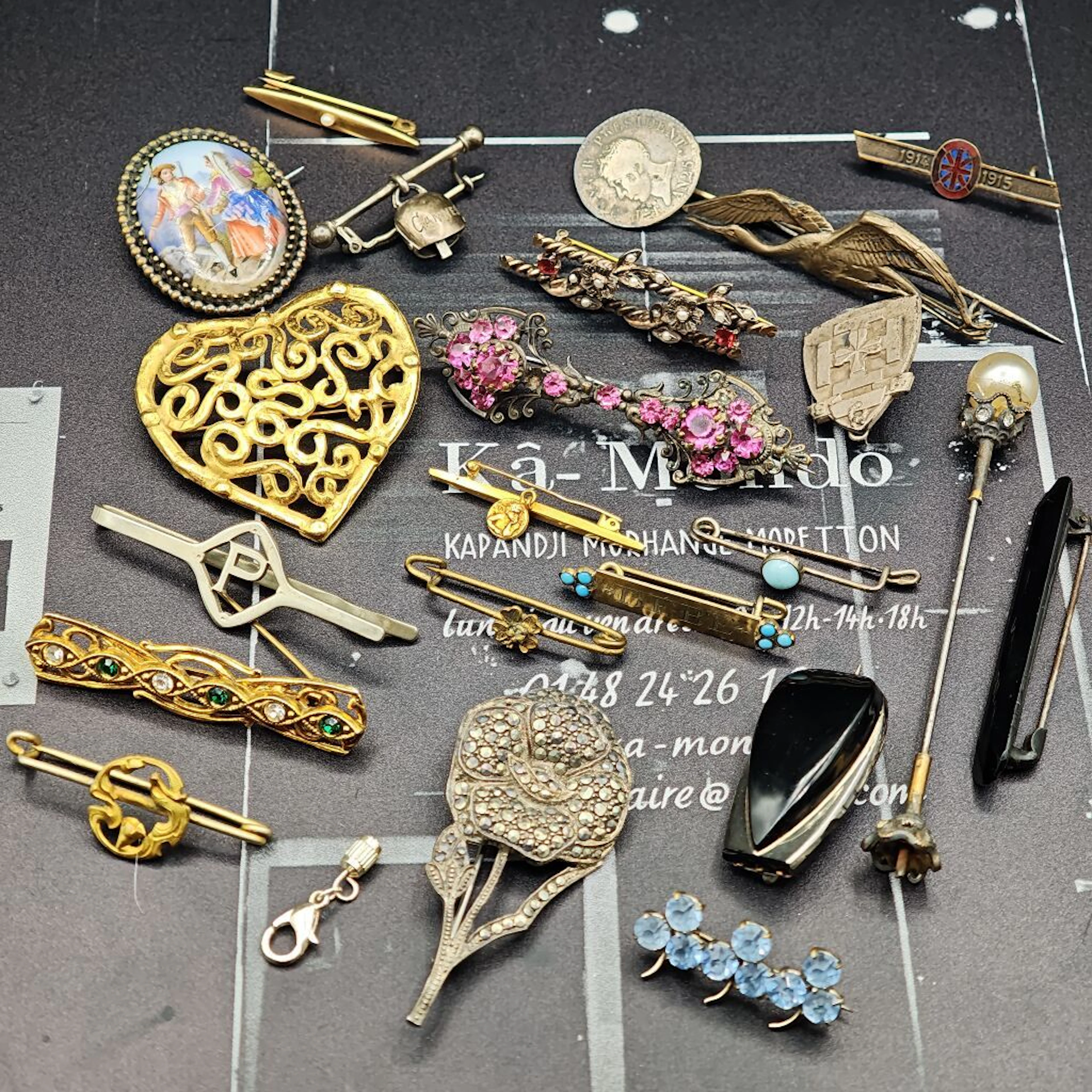 A collection of base-metal pins—not safety pins, but lapel pins, not