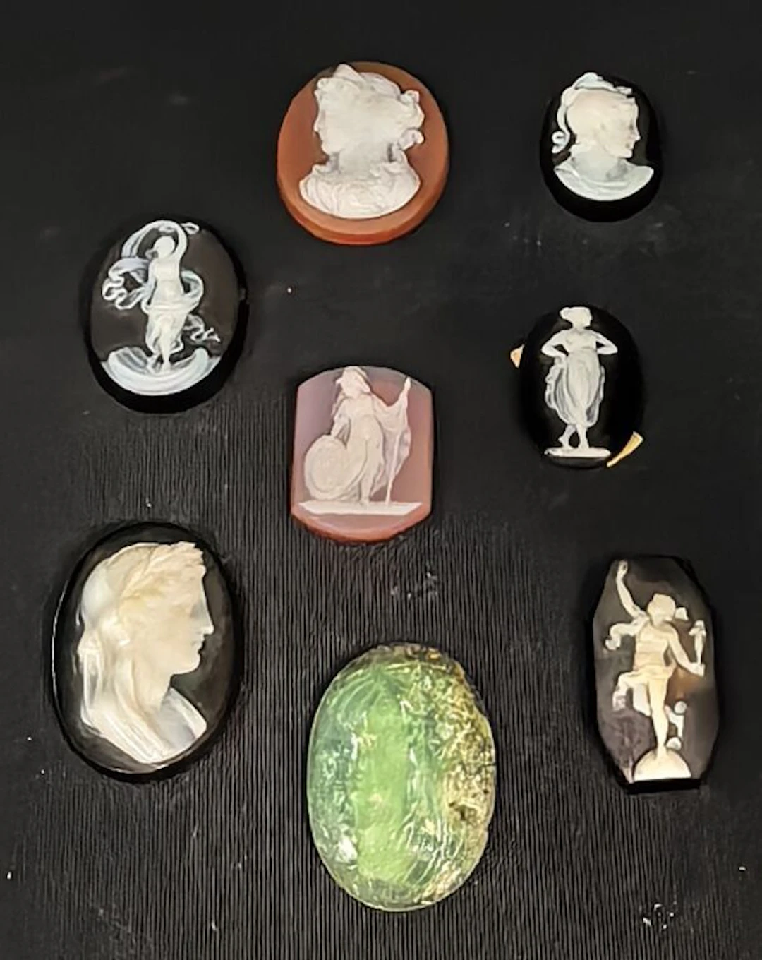 Set of 8 cameos on carnelian, agate, onyx, and boehmite, featuring