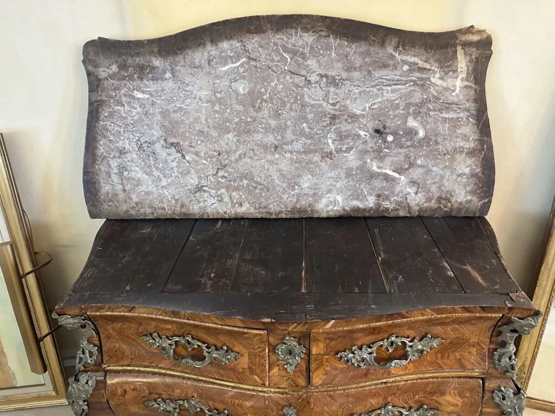A curved chest of drawers with a tomb-like shape on all sides, made
