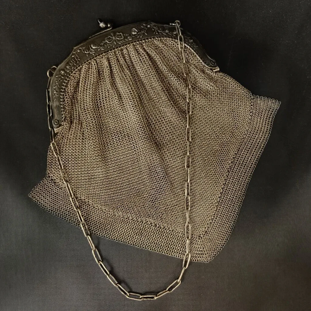 Silver plated metal evening bag in a "chain mail" style, with a frame