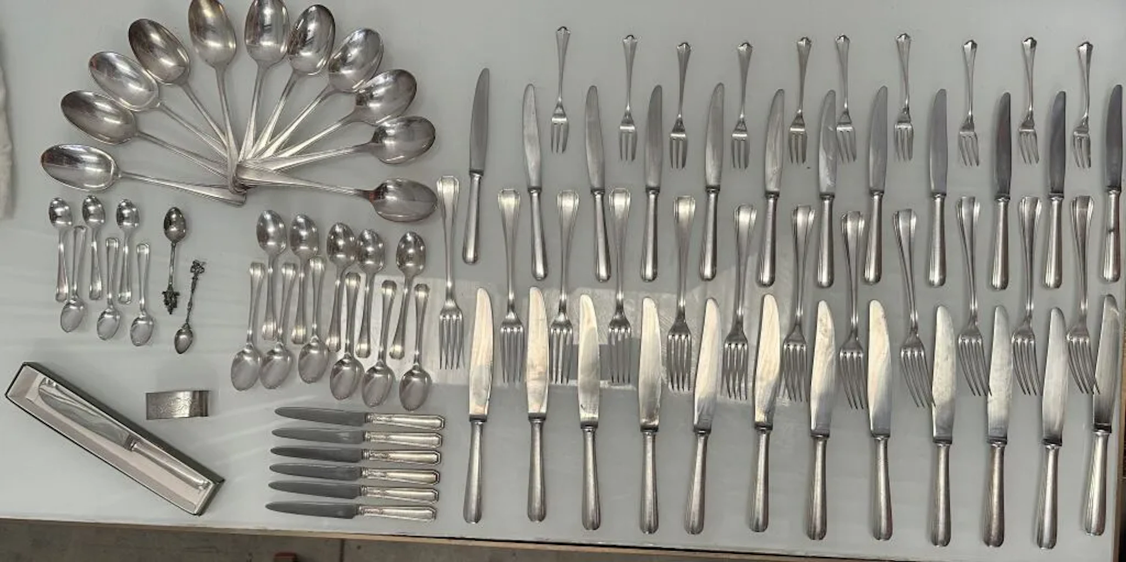 CHRISTOFLE. Art Deco-style silver plated cutlery set, including: -