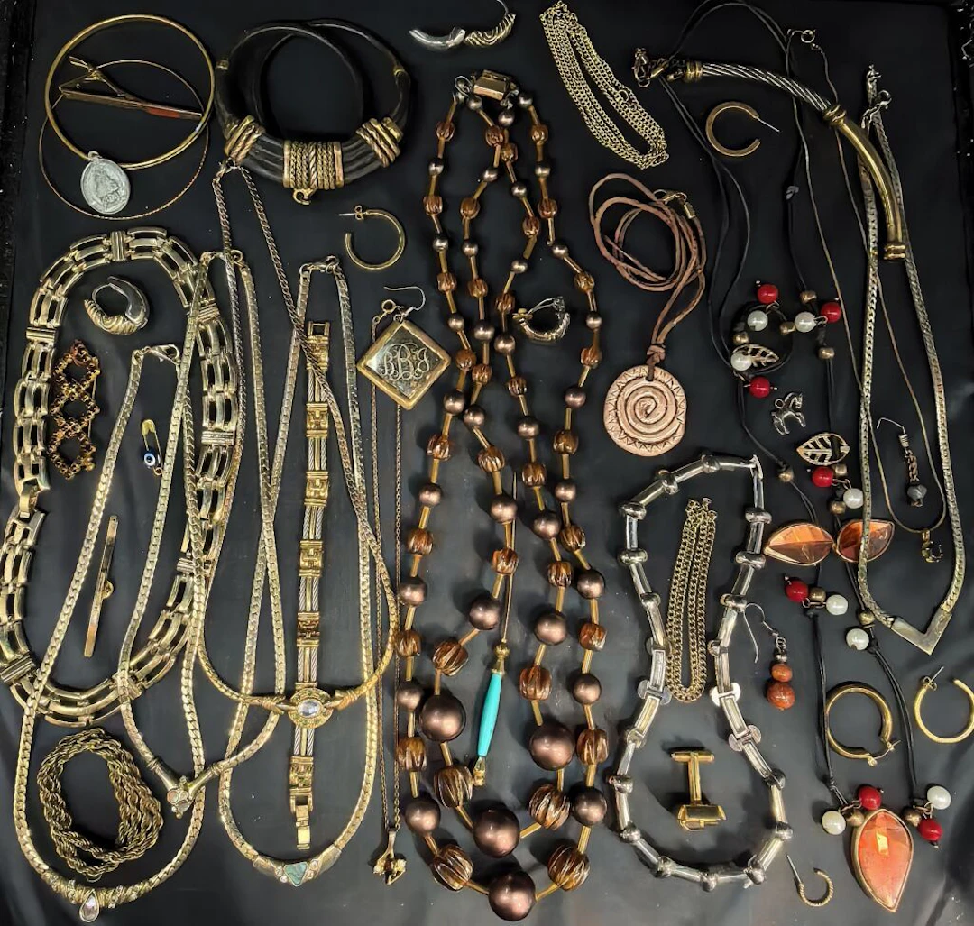 A collection of costume jewelry—including necklaces made of metal