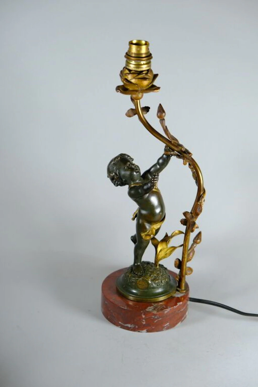 Small living room lamp in patinated and gilded bronze, decorated with