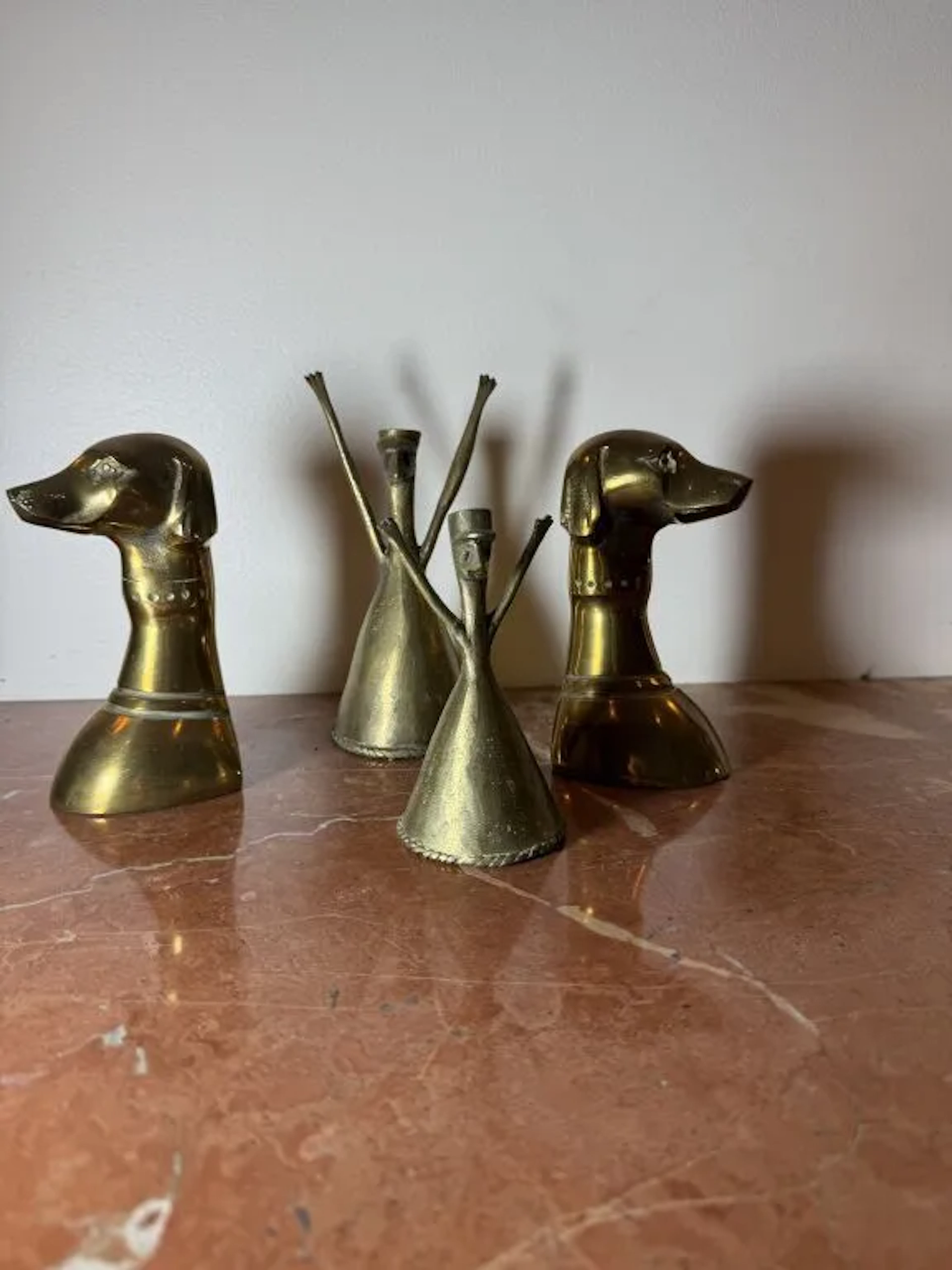 A small, unique lot consisting of: - a pair of brass bookends shaped