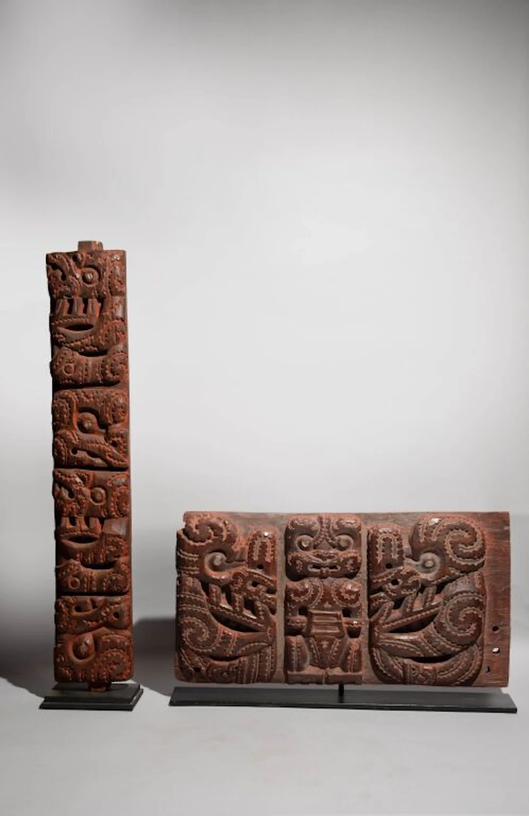 Two architectural panels decorated with Tiki figures featuring mother-of-pearl