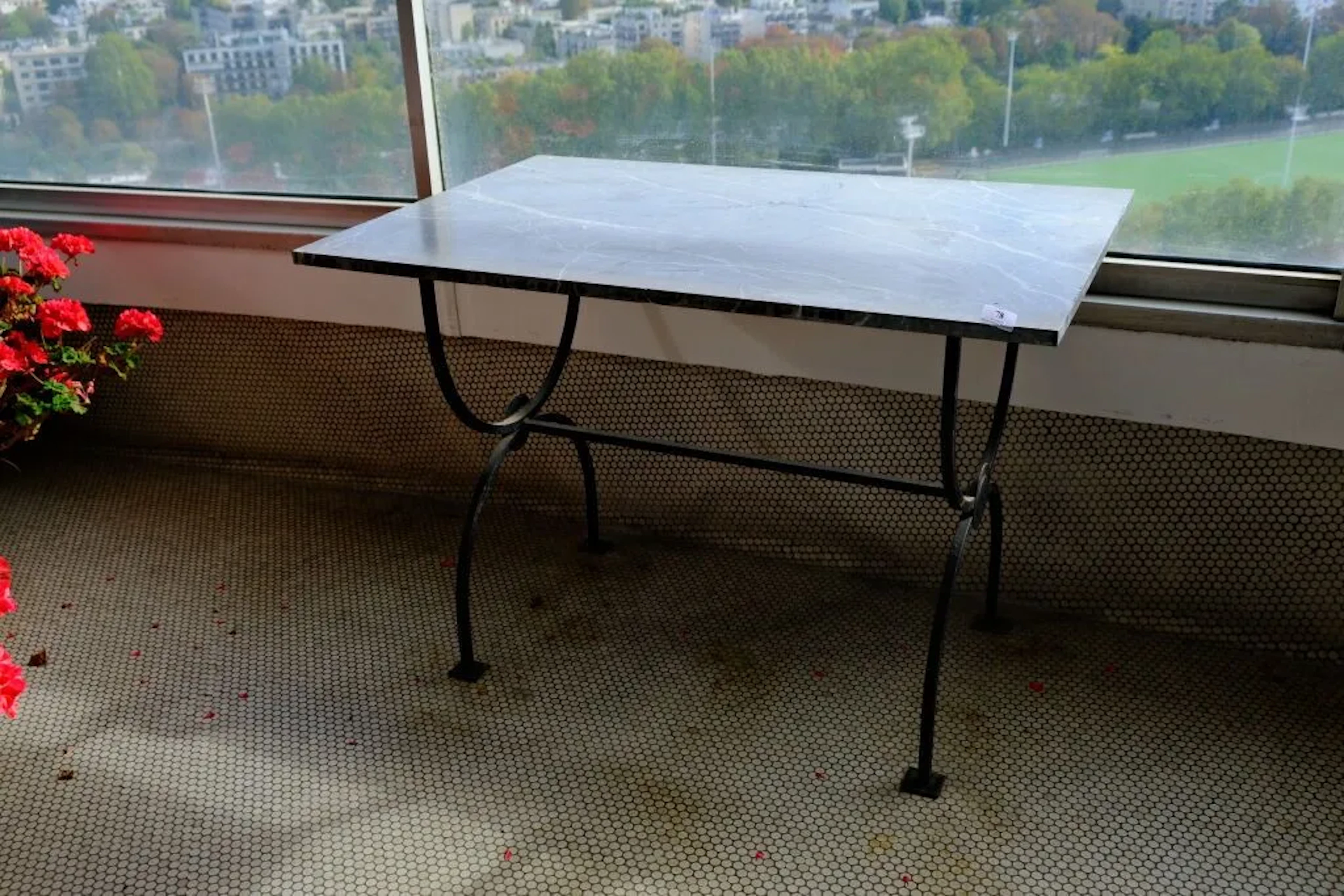 A Directoire-inspired pastry or garden table, featuring a white veined