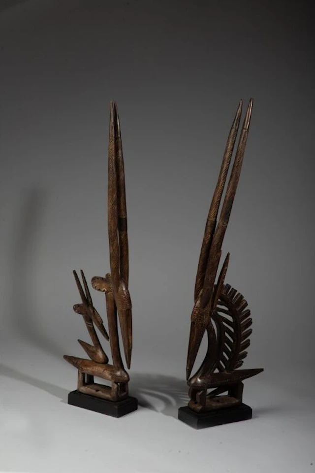 Pair of Tyi Wara crests depicting two gazelles carved in a geometric