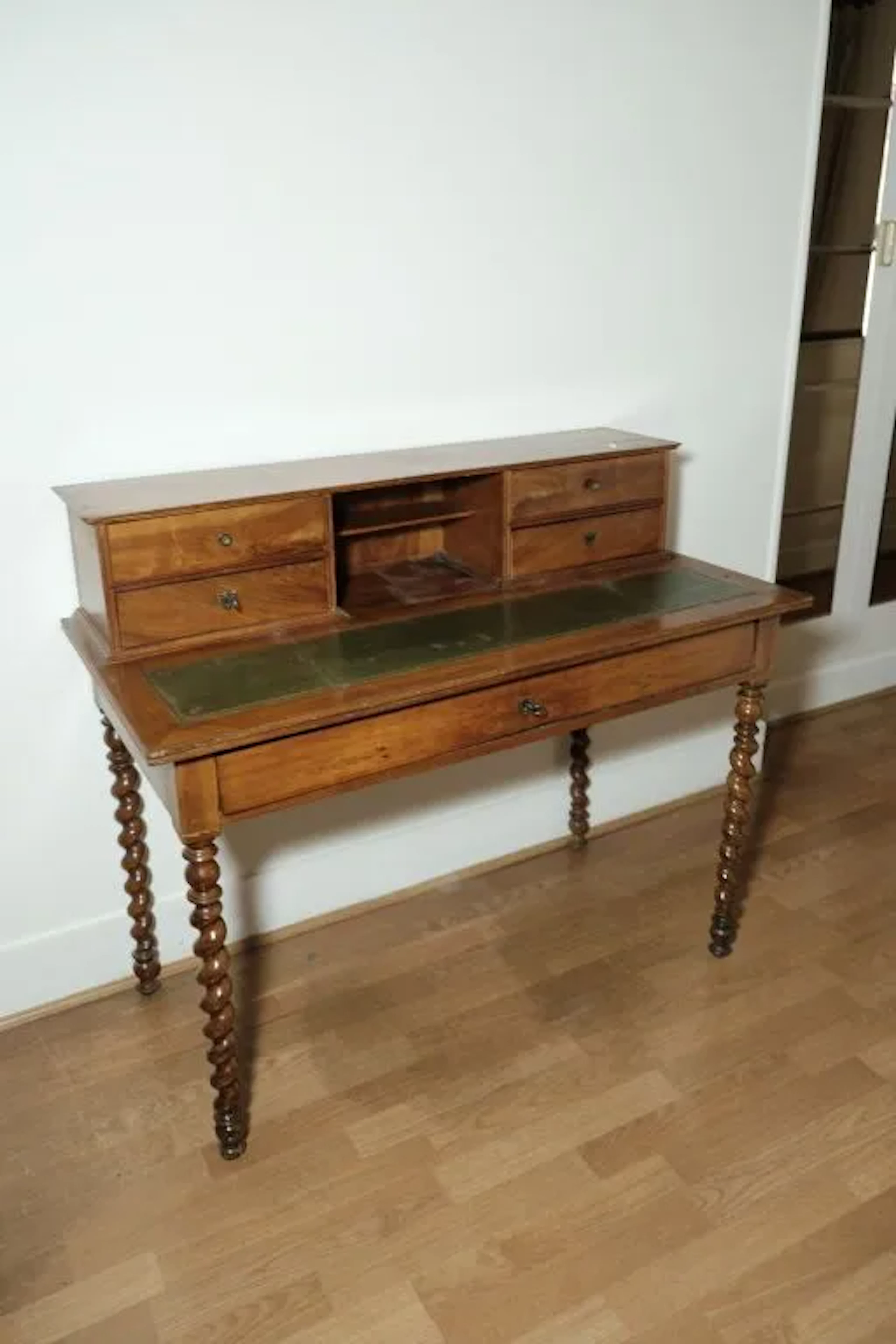 Small stepped desk made of wood veneer, featuring four small drawers