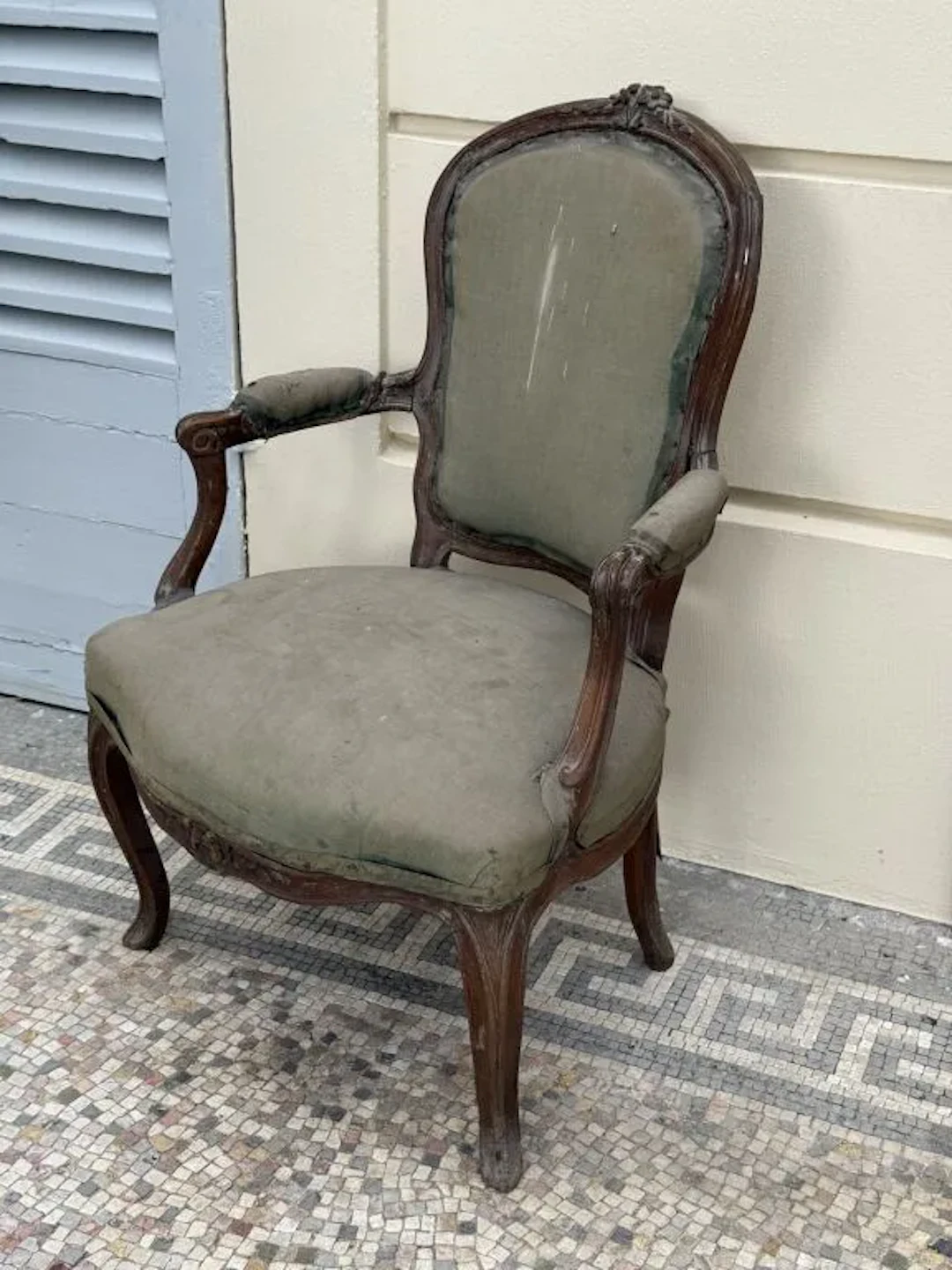Natural wood armchair with molded panels, a cabriolet backrest carved