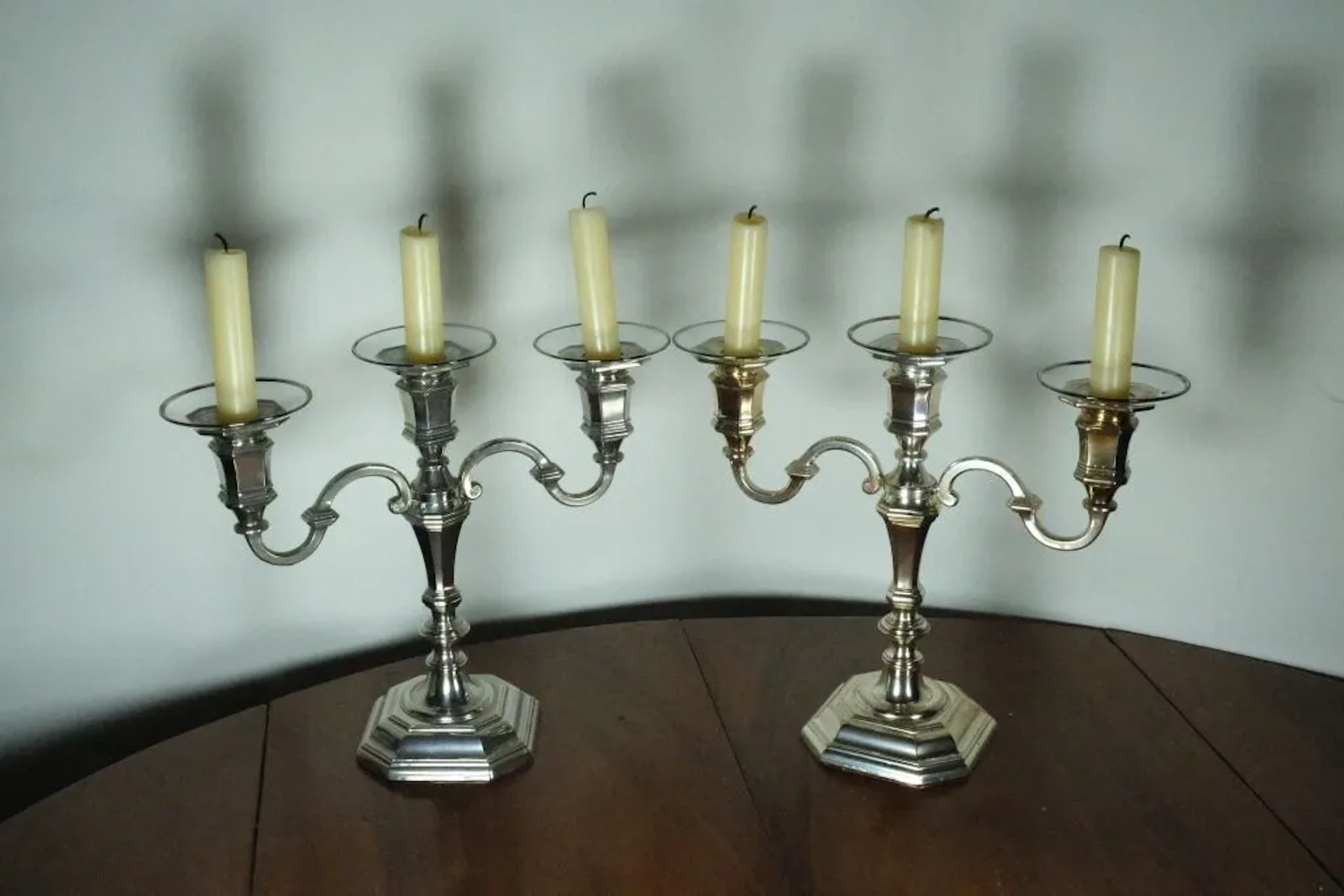 Pair of silver-plated metal table-end candelabras with three light
