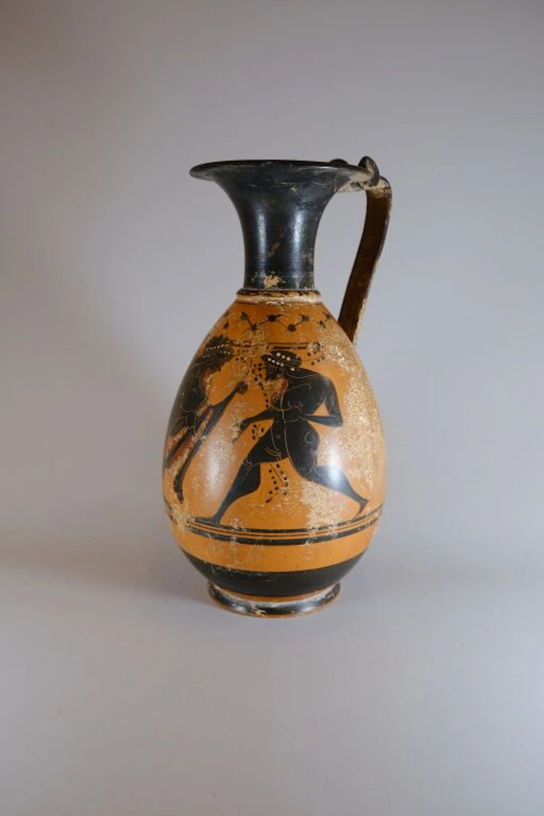 Terracotta olpe made using the black-figure technique, decorated with