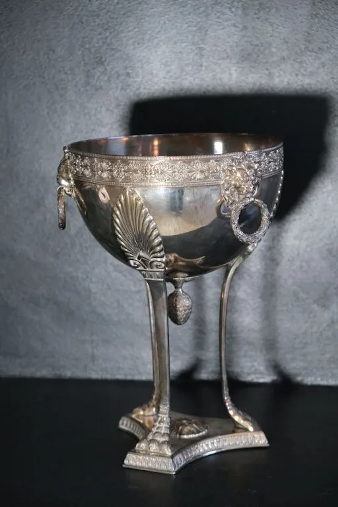 A silver plated table centerpiece in the shape of an Athenian statue