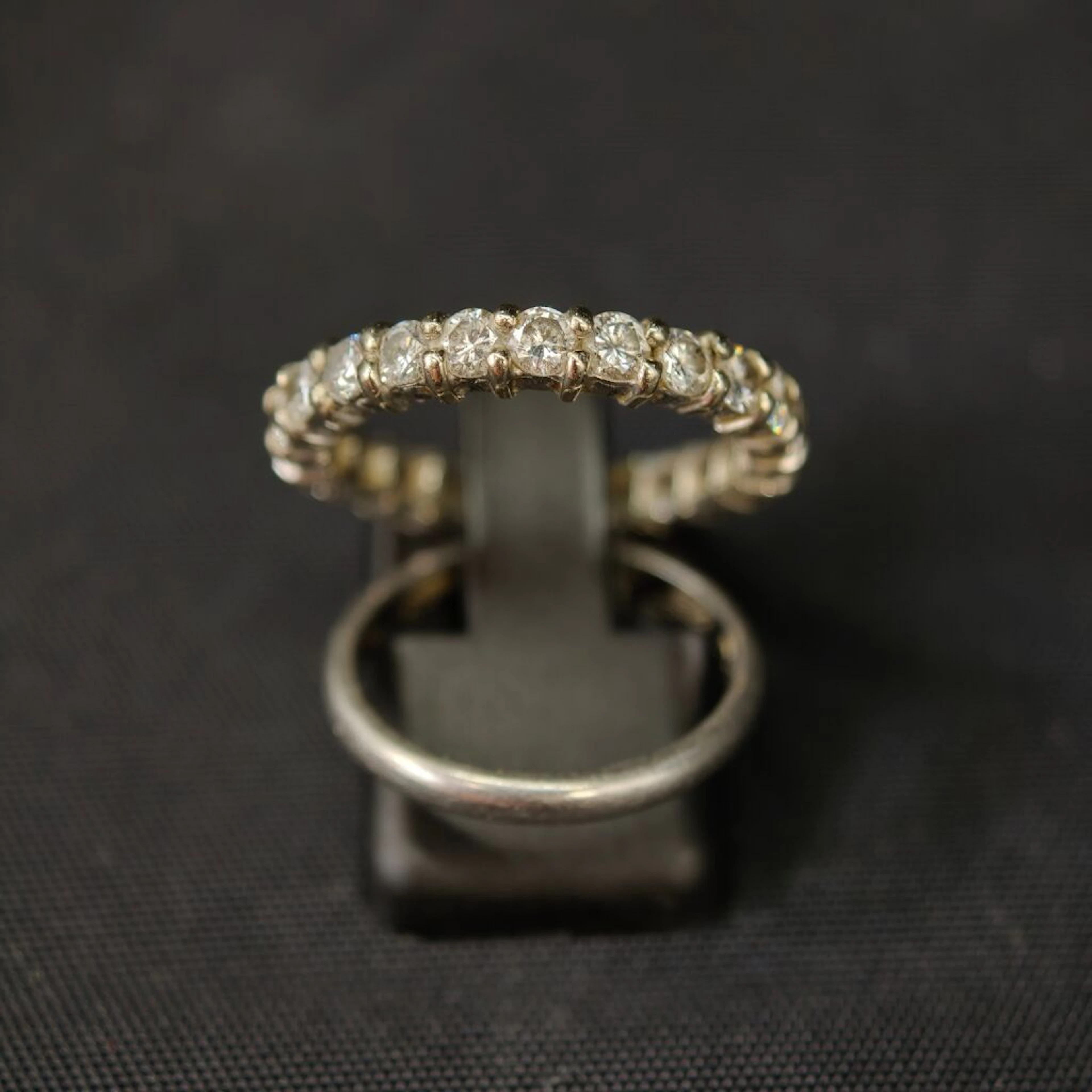 Set of two 950‰ platinum wedding bands, one entirely set with brilliant-cut