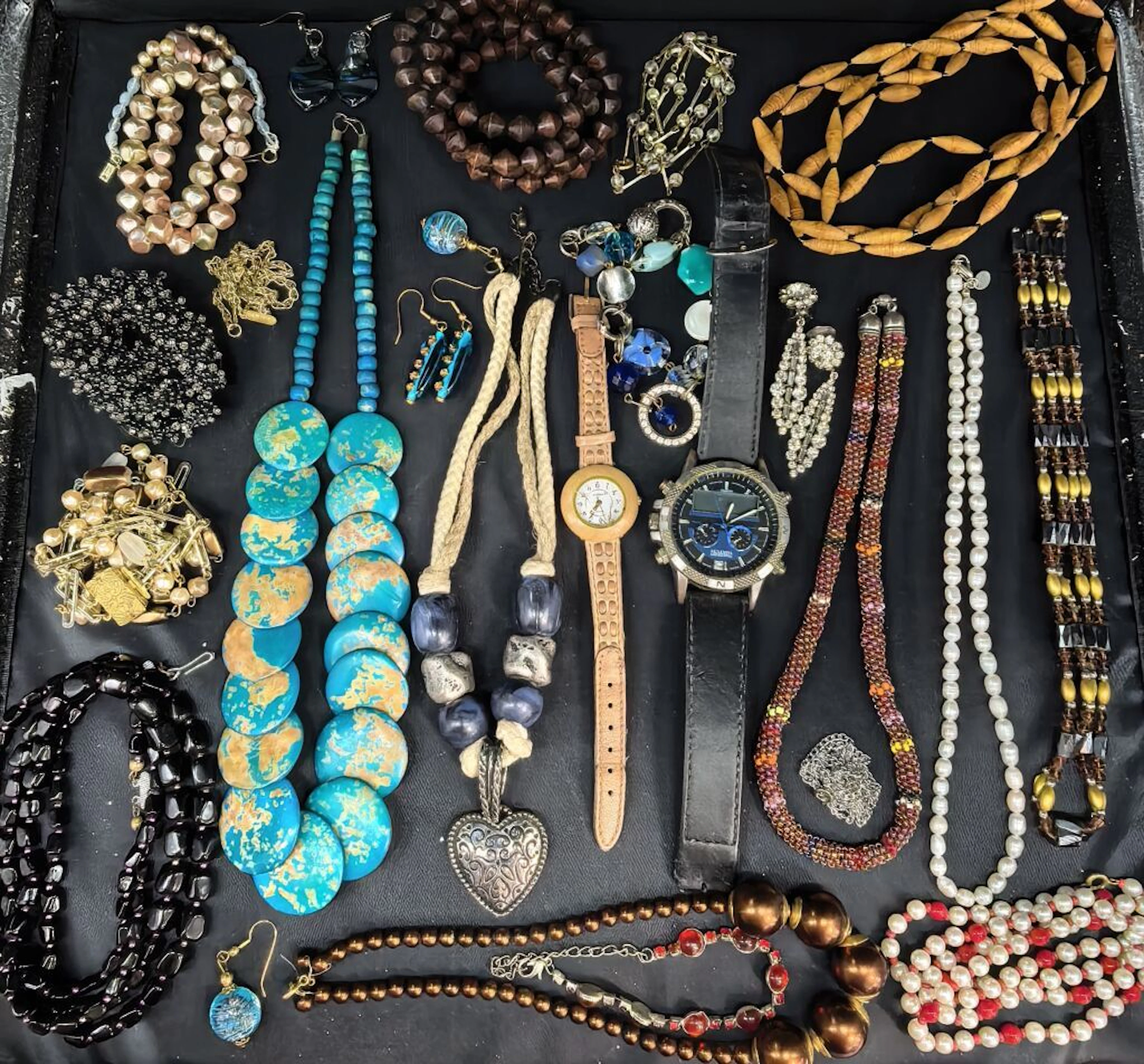 A collection of costume jewelry, watches, necklaces, imitation pearls