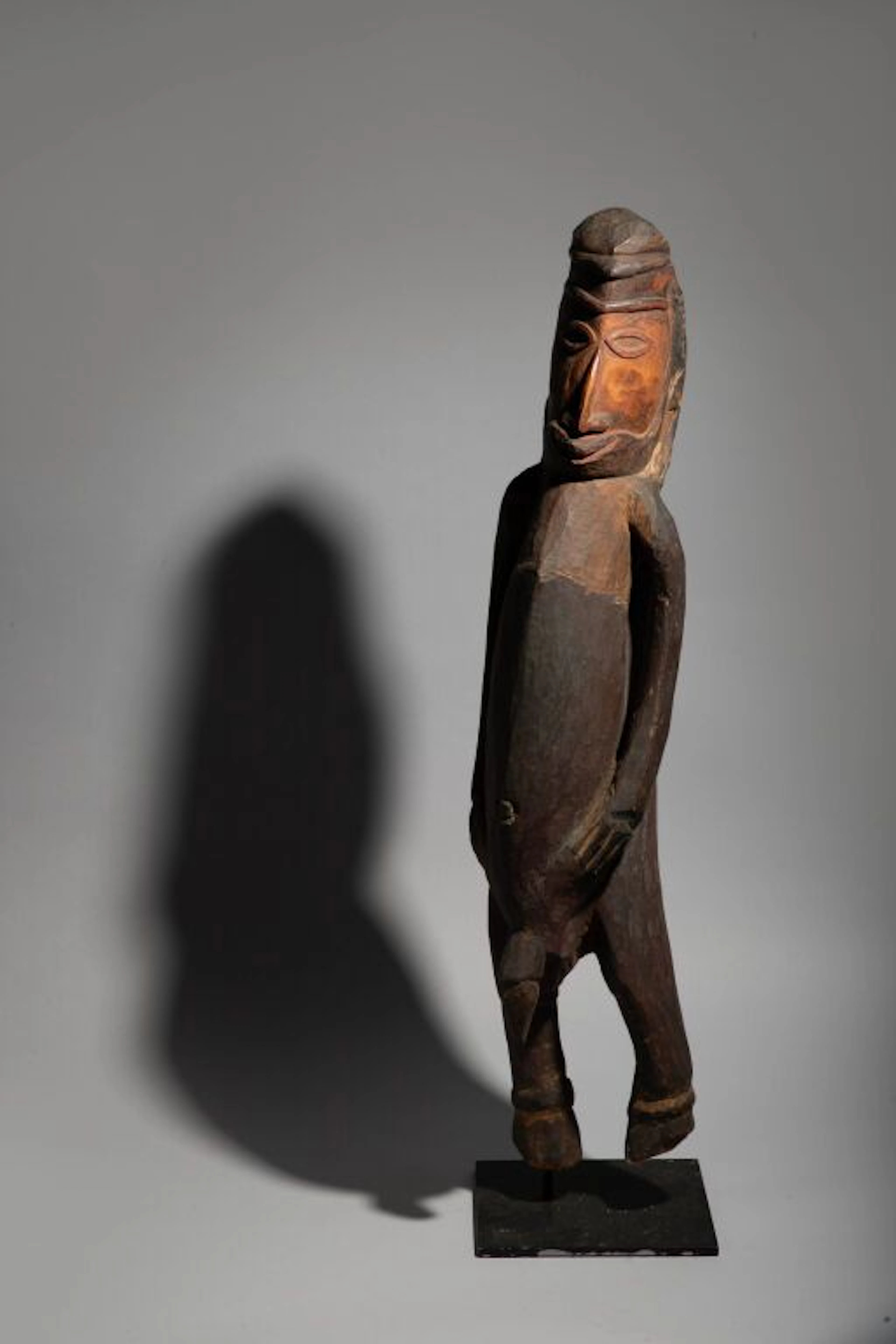 A male figure standing with his hands below his navel in a slightly