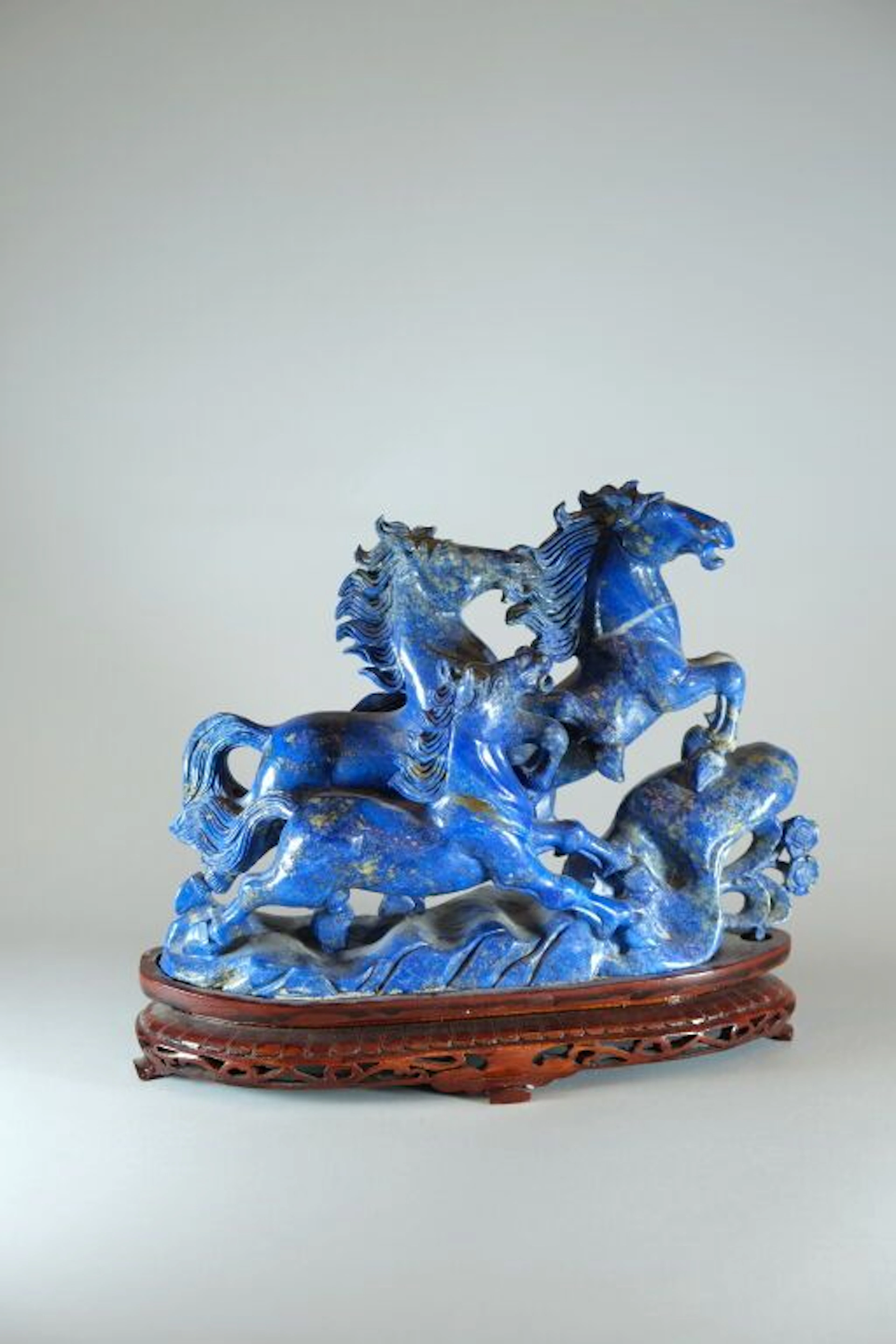CHINA, 20th century. A lapis lazuli sculpture depicting three wild