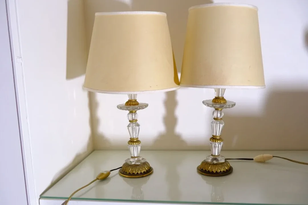 Pair of crystal and gilded bronze bedside lamps. French craftsmanship